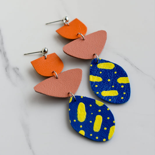 Hand painted and handmade, light weight and comfortable to wear all day long leather earrings. All our earring hooks are made with a high quality stainless steel and they are hypo allergenic. &nbsp;They will not tarnish or irritate your sensitive skin.

