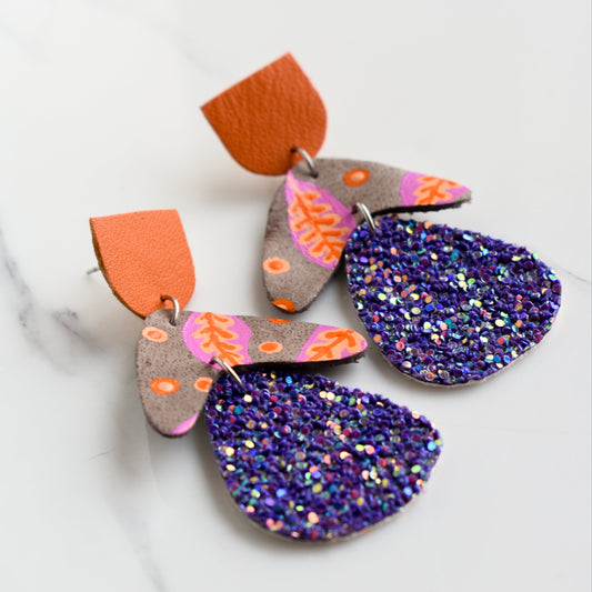 Hand painted and handmade, light weight and comfortable to wear all day long leather earrings. All our earring hooks are made with a high quality stainless steel and they are hypo allergenic. &nbsp;They will not tarnish or irritate your sensitive skin.

