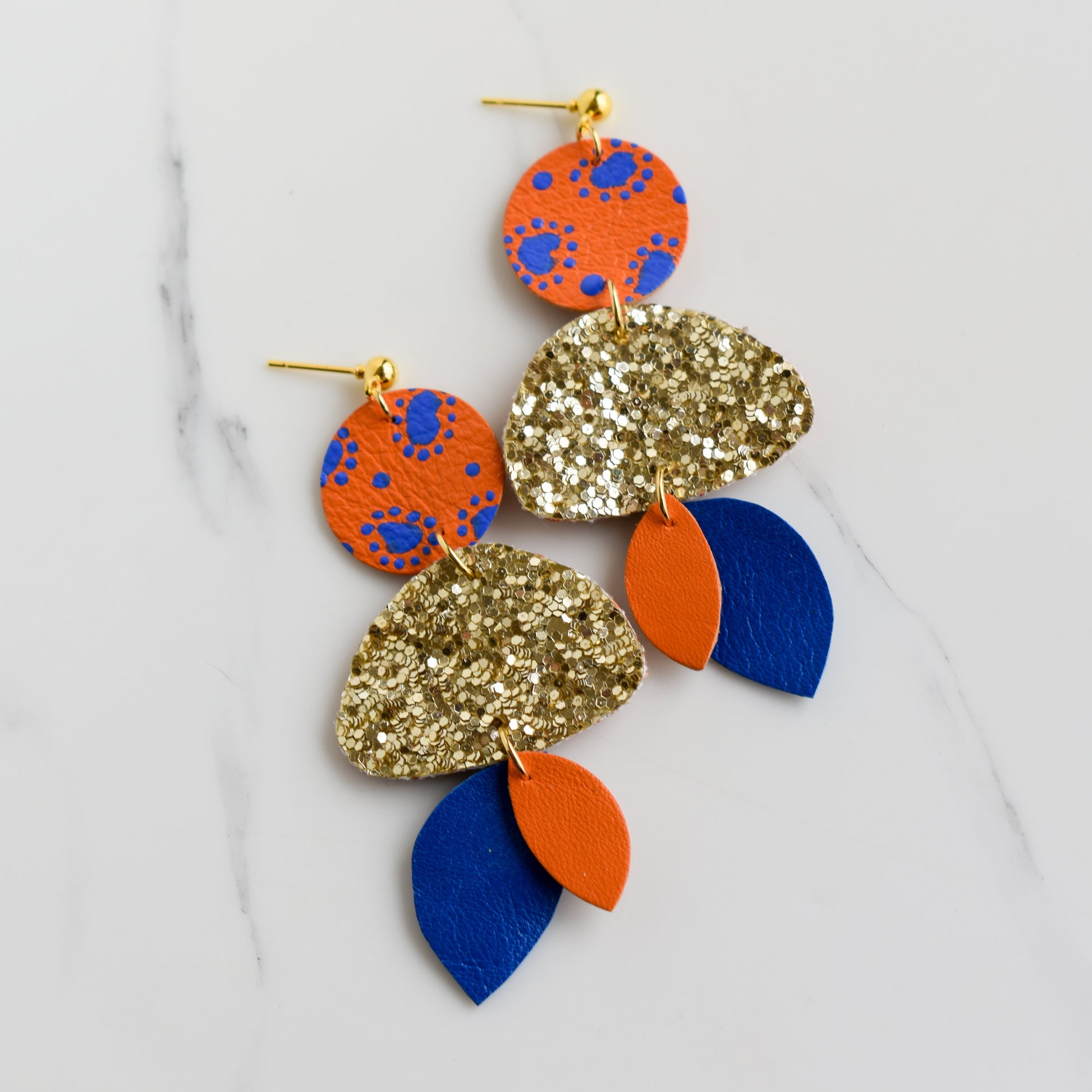 Hand painted and handmade, light weight and comfortable to wear all day long leather earrings. All our earring hooks are made with a high quality stainless steel and they are hypo allergenic. &nbsp;They will not tarnish or irritate your sensitive skin.

