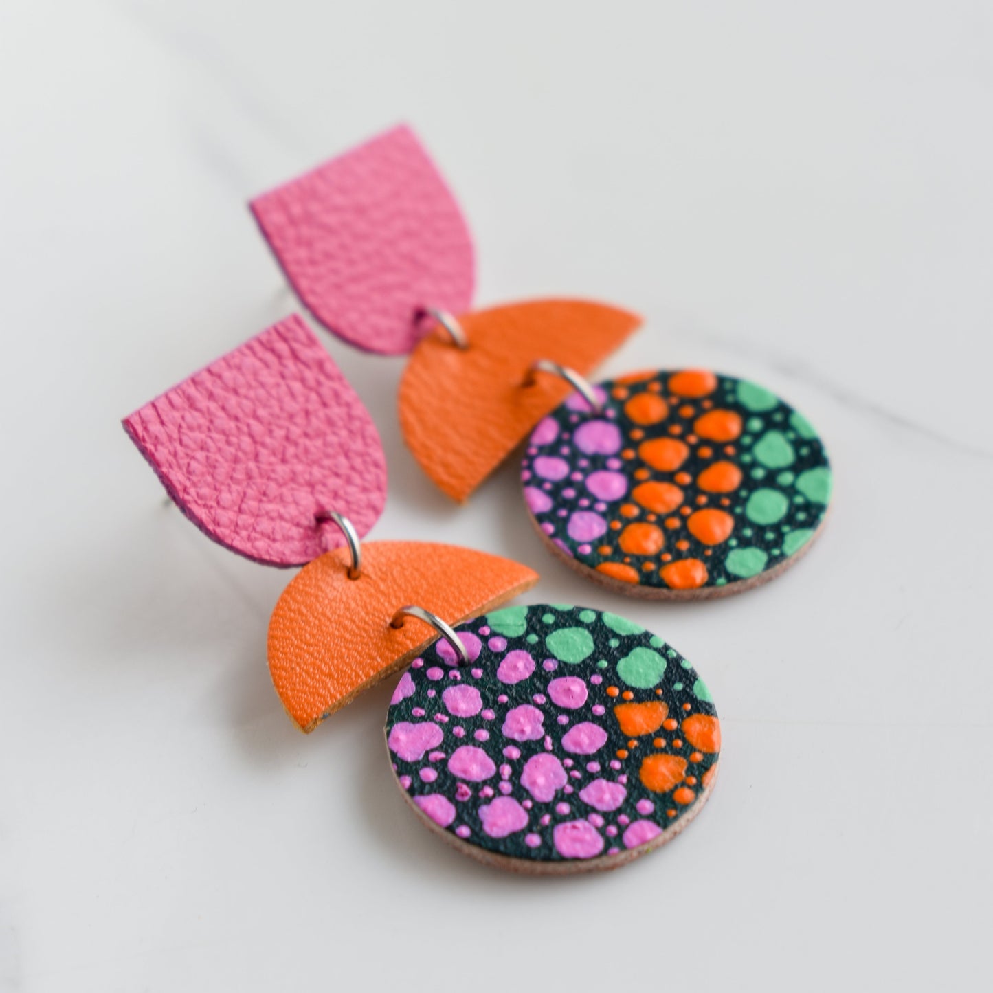 Hand painted and handmade, light weight and comfortable to wear all day long leather earrings. All our earring hooks are made with a high quality stainless steel and they are hypo allergenic. &nbsp;They will not tarnish or irritate your sensitive skin.

