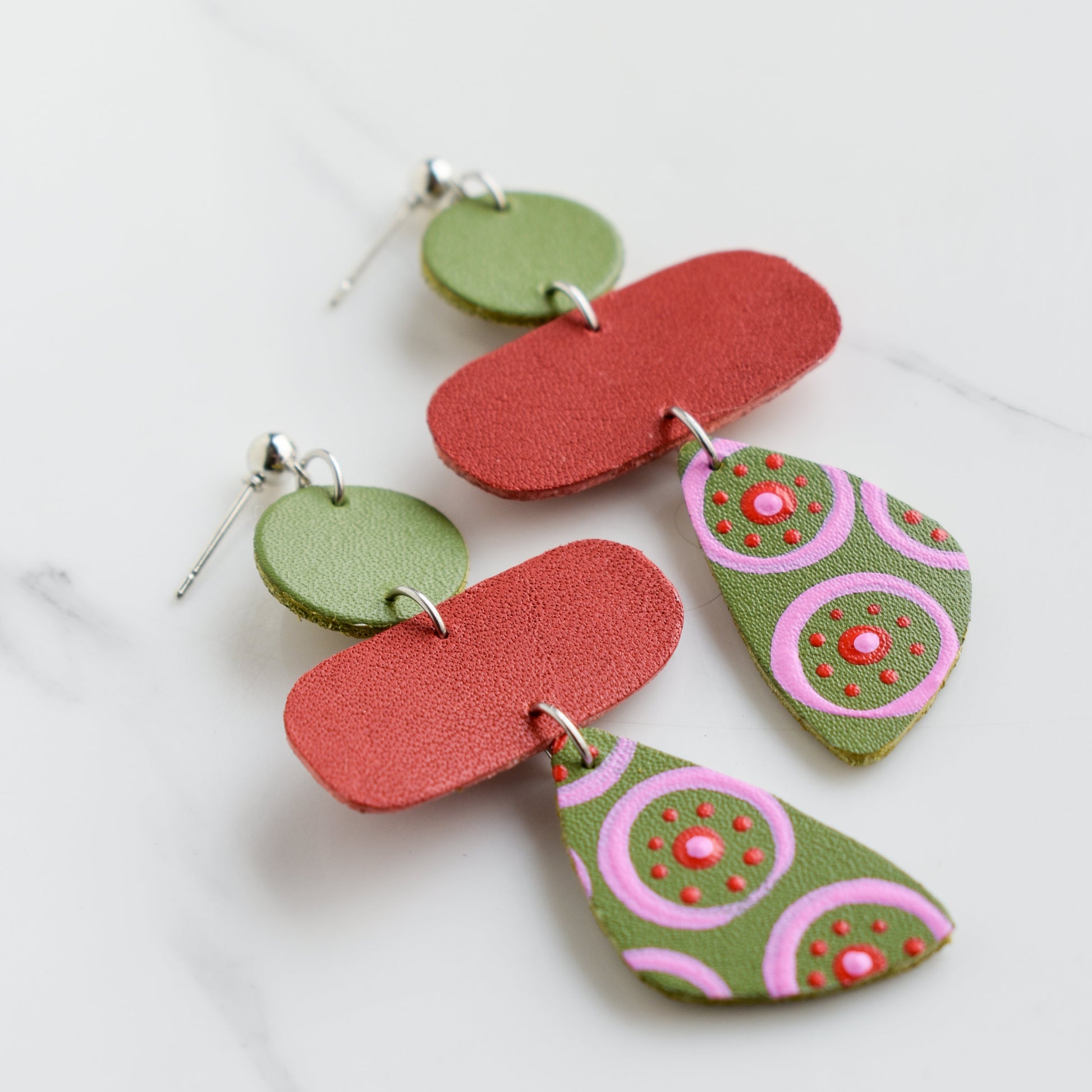 Hand painted and handmade, light weight and comfortable to wear all day long leather earrings. All our earring hooks are made with a high quality stainless steel and they are hypo allergenic. &nbsp;They will not tarnish or irritate your sensitive skin.

