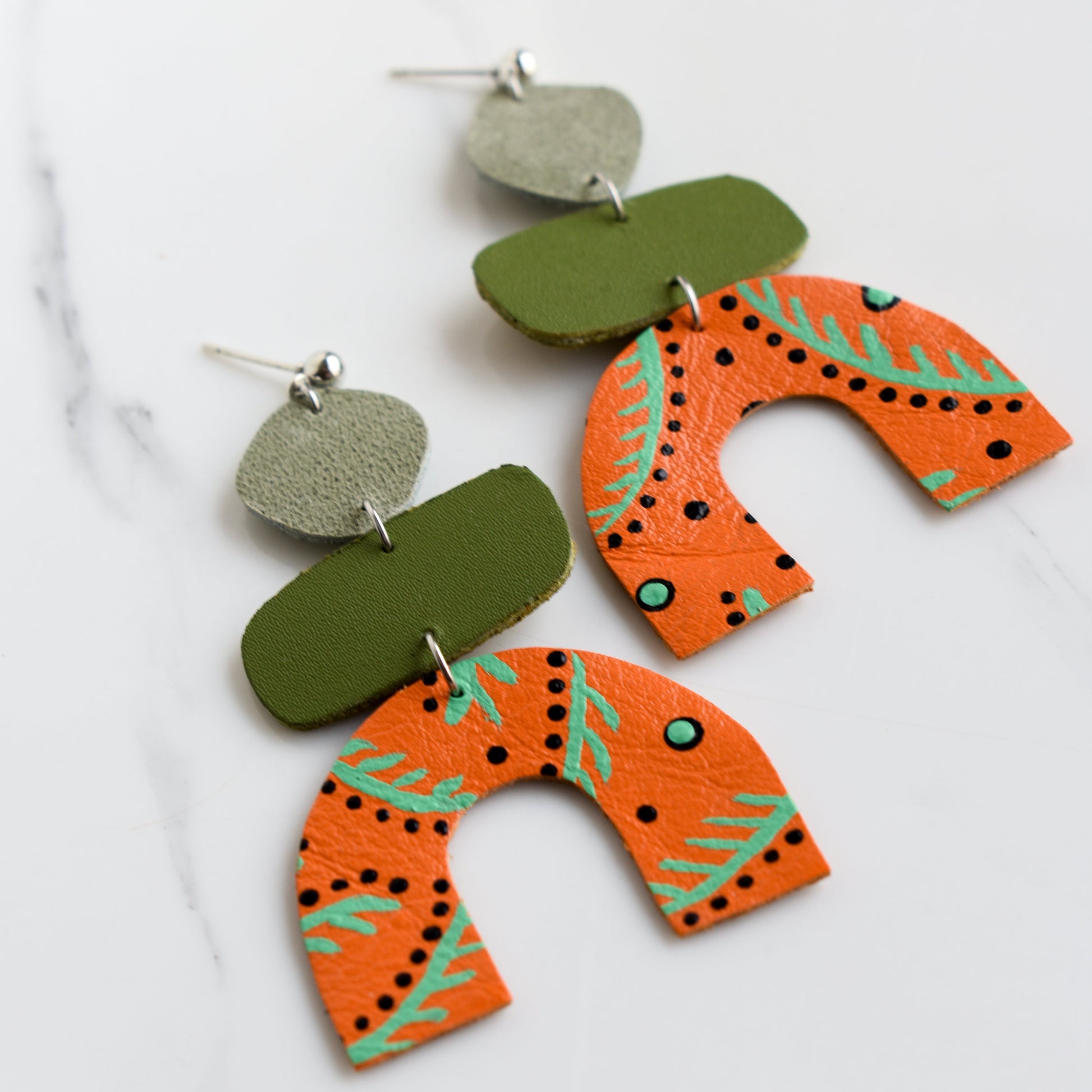 Hand painted and handmade, light weight and comfortable to wear all day long leather earrings. All our earring hooks are made with a high quality stainless steel and they are hypo allergenic. &nbsp;They will not tarnish or irritate your sensitive skin.

