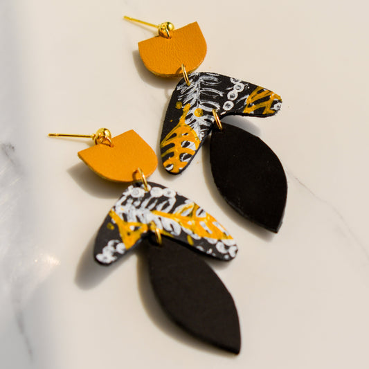 Hand painted and handmade, light weight and comfortable to wear all day long leather earrings. All our earring hooks are made with a high quality stainless steel and they are hypo allergenic. &nbsp;They will not tarnish or irritate your sensitive skin.

