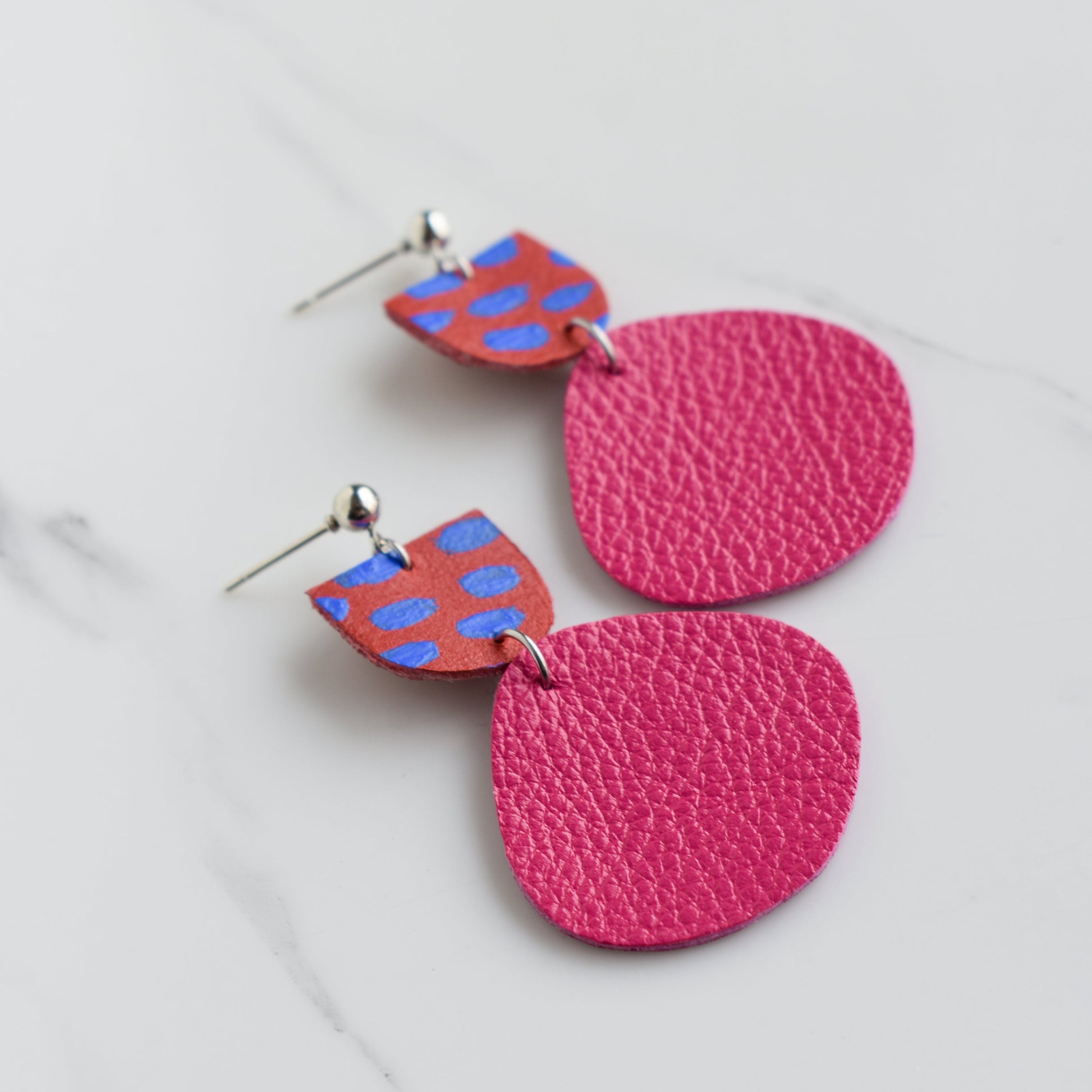 Hand painted and handmade, light weight and comfortable to wear all day long leather earrings. All our earring hooks are made with a high quality stainless steel and they are hypo allergenic. &nbsp;They will not tarnish or irritate your sensitive skin.

