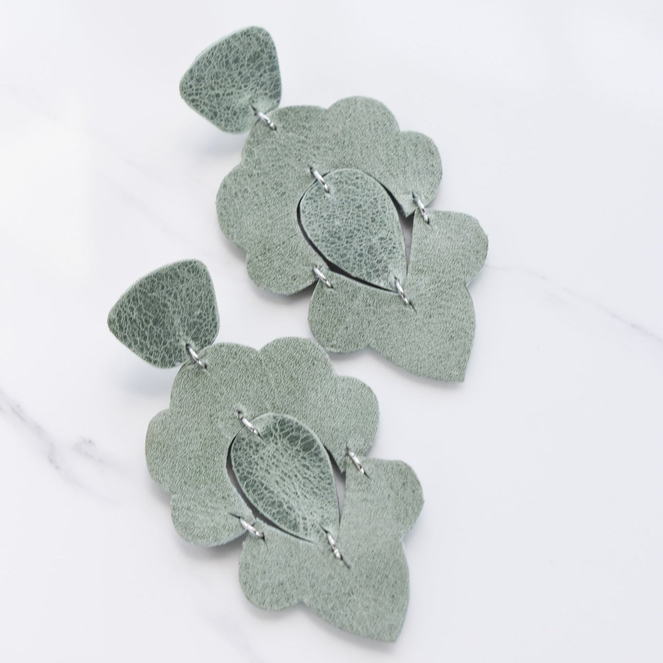 Handmade, light weight and comfortable to wear all day long leather earrings. All our earring hooks are made with a high quality stainless steel and they are hypo allergenic.  They will not tarnish or irritate your sensitive skin.