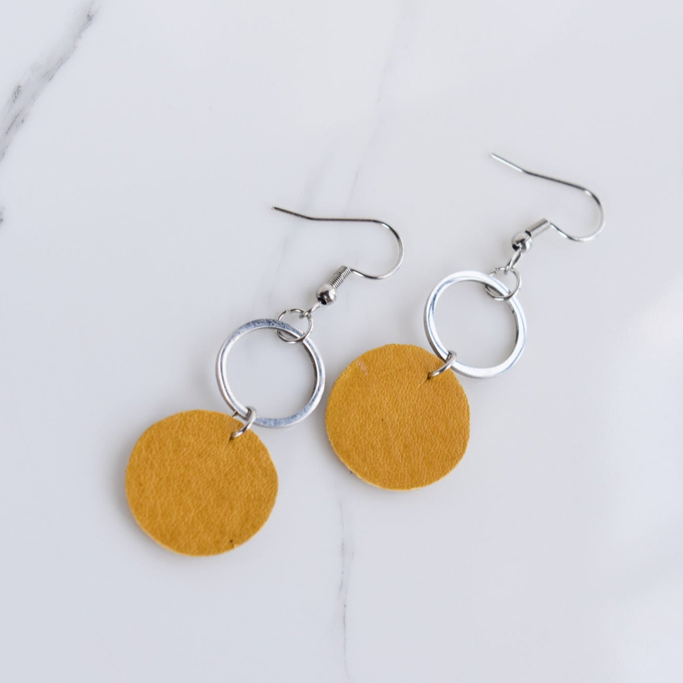 Handmade, light weight and comfortable to wear all day long leather earrings. All our earring hooks are made with a high quality stainless steel and they are hypo allergenic.  They will not tarnish or irritate your sensitive skin.