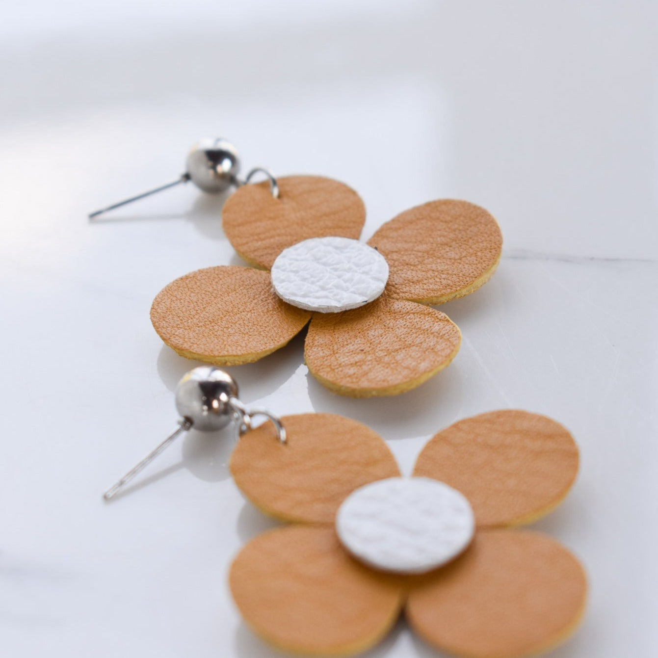 Handmade, light weight and comfortable to wear all day long leather earrings. All our earring hooks are made with a high quality stainless steel and they are hypo allergenic.  They will not tarnish or irritate your sensitive skin.