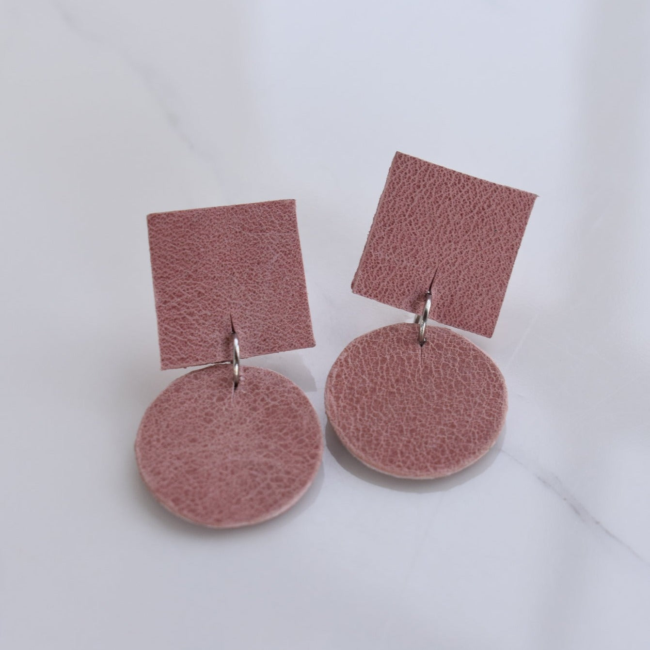 Handmade, light weight and comfortable to wear all day long leather earrings. All our earring hooks are made with a high quality stainless steel and they are hypo allergenic.  They will not tarnish or irritate your sensitive skin.