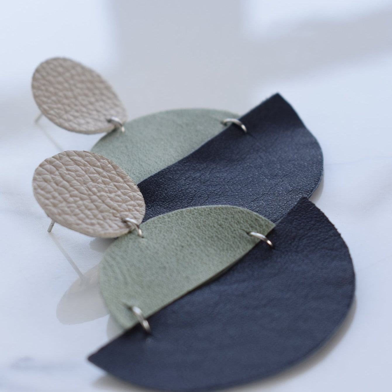 Handmade, light weight and comfortable to wear all day long leather earrings. All our earring hooks are made with a high quality stainless steel and they are hypo allergenic.  They will not tarnish or irritate your sensitive skin.