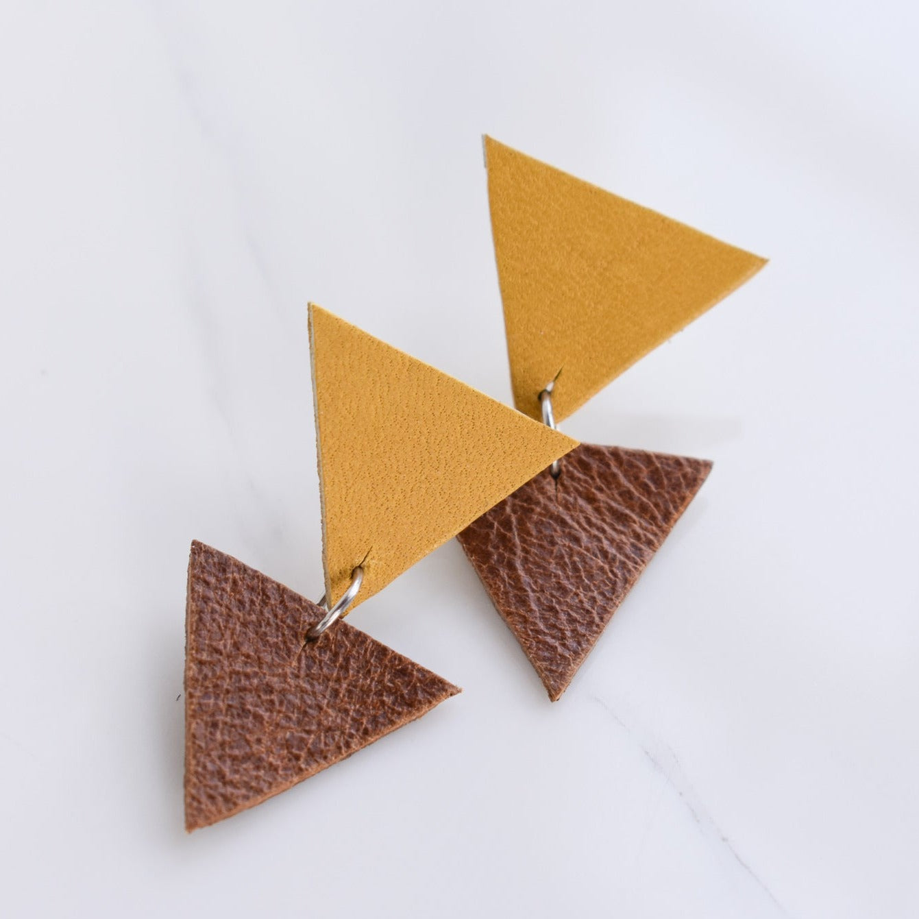 Handmade, light weight and comfortable to wear all day long leather earrings. All our earring hooks are made with a high quality stainless steel and they are hypo allergenic.  They will not tarnish or irritate your sensitive skin.