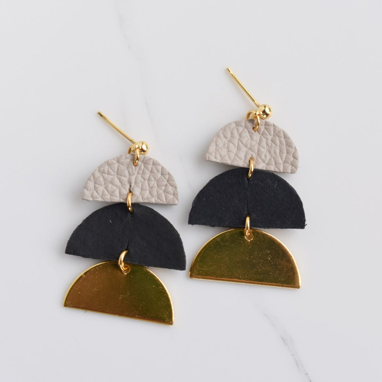 Handmade, light weight and comfortable to wear all day long leather earrings. All our earring hooks are made with a high quality stainless steel and they are hypo allergenic.  They will not tarnish or irritate your sensitive skin.