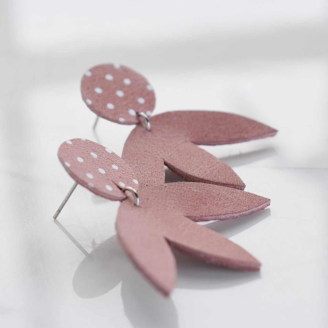 Handmade, light weight and comfortable to wear all day long leather earrings. All our earring hooks are made with a high quality stainless steel and they are hypo allergenic.  They will not tarnish or irritate your sensitive skin.