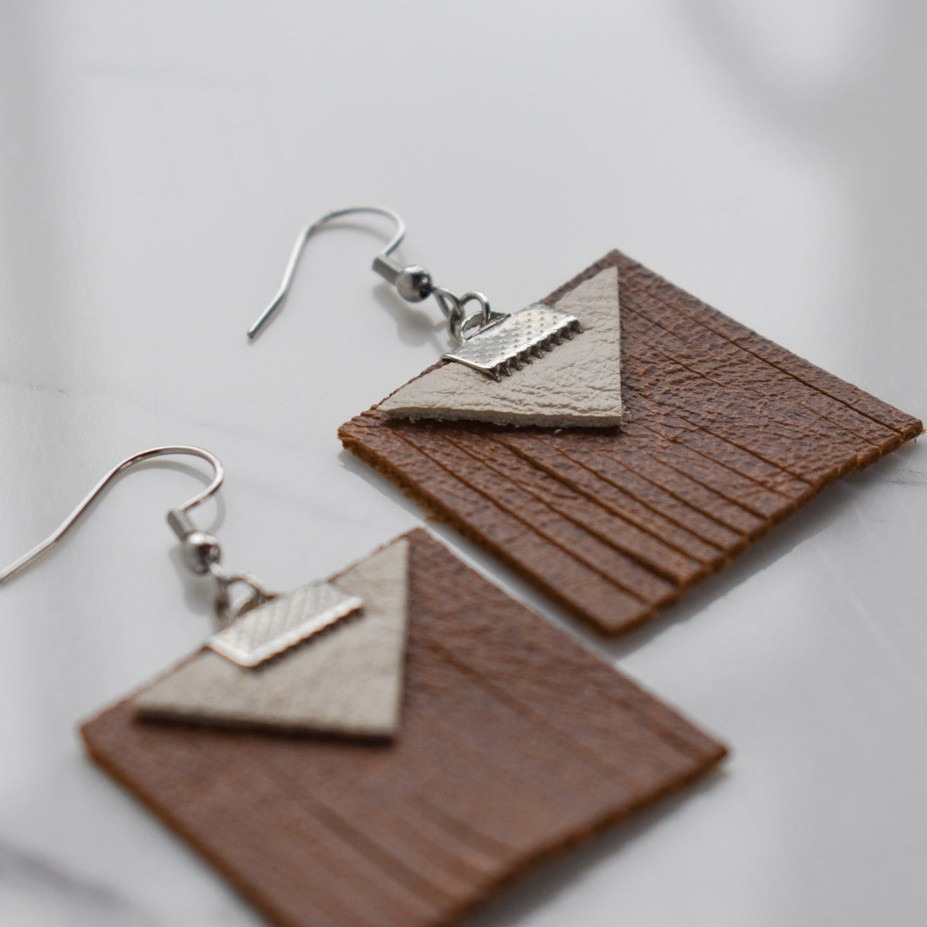 Handmade, light weight and comfortable to wear all day long leather earrings. All our earring hooks are made with a high quality stainless steel and they are hypo allergenic.  They will not tarnish or irritate your sensitive skin.