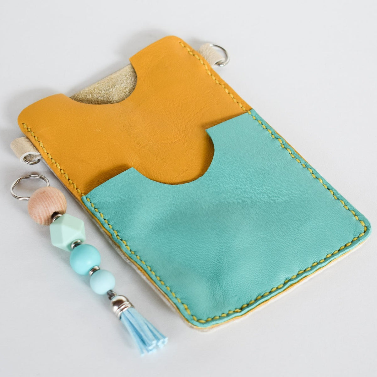 Beautifully handmade and hand stitched leather cellphone sling. Perfect for everyday use. It has a slot for cards and cash. Turn your sling towards your body for extra safety. This also makes an amazing gift and addition to a bridesmaids gift box. YOUR NEW BEST FRIEND - keep your belongings HANDS ON! 