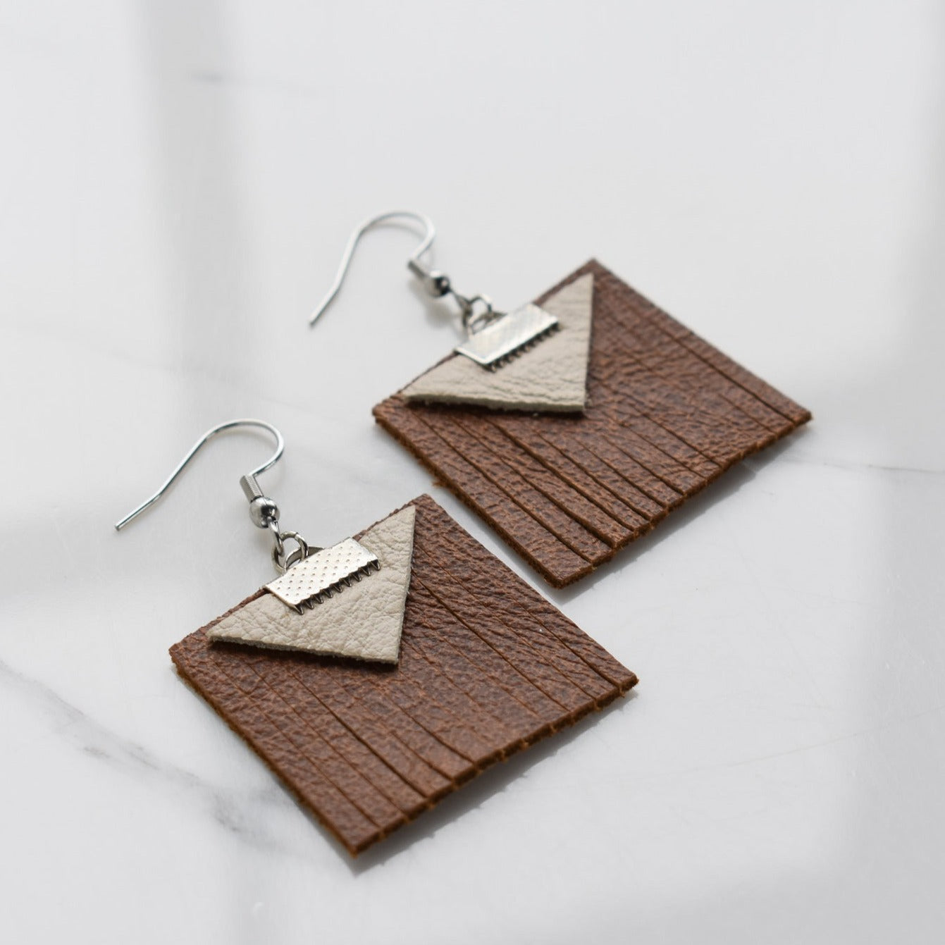 Handmade, light weight and comfortable to wear all day long leather earrings. All our earring hooks are made with a high quality stainless steel and they are hypo allergenic.  They will not tarnish or irritate your sensitive skin.