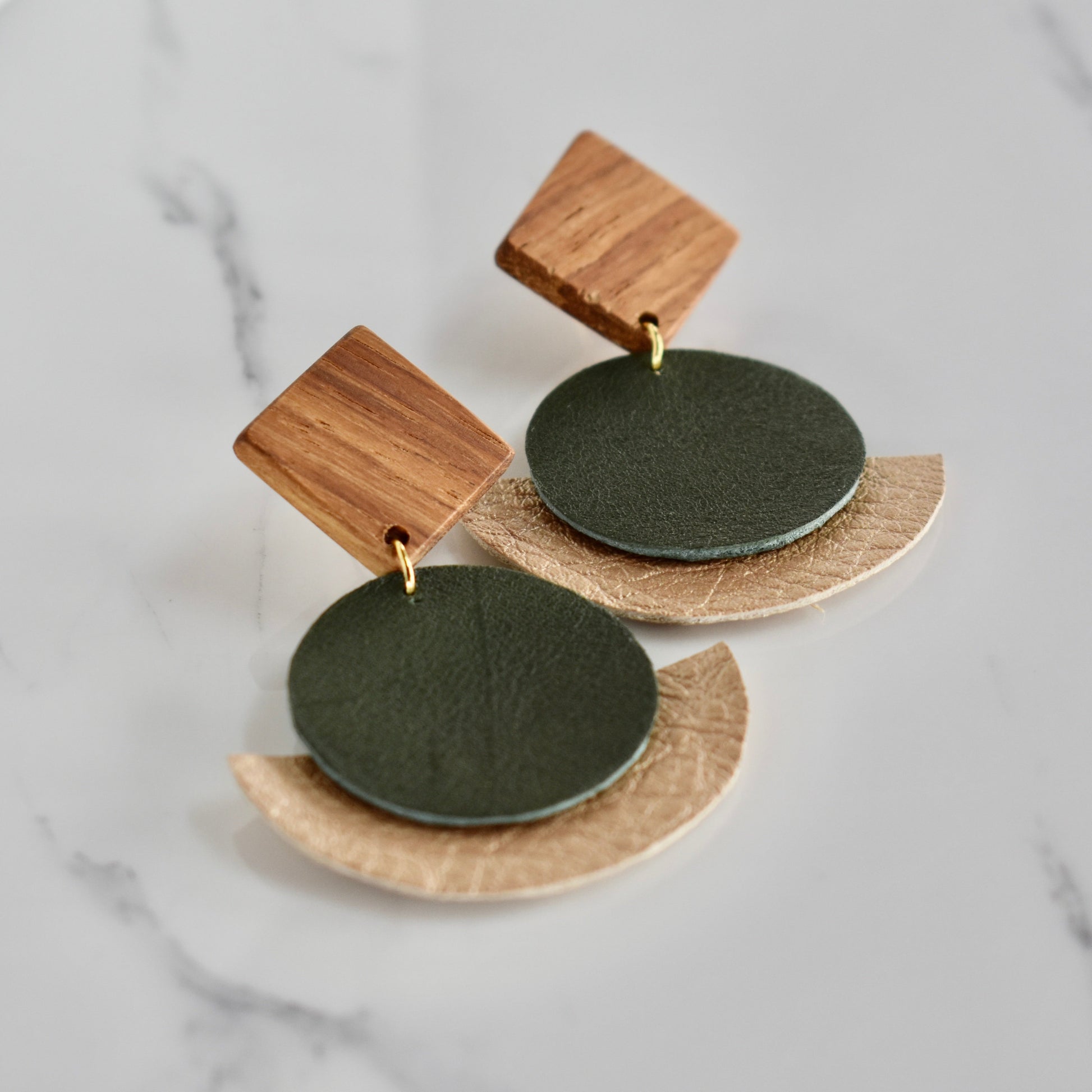 Handmade, light weight and comfortable to wear all day long solid wood (Kiaat) and leather earrings. Available in silver or gold. All our earring hooks are made with a high quality stainless steel and they are hypo allergenic.  They will not tarnish or irritate your sensitive skin.