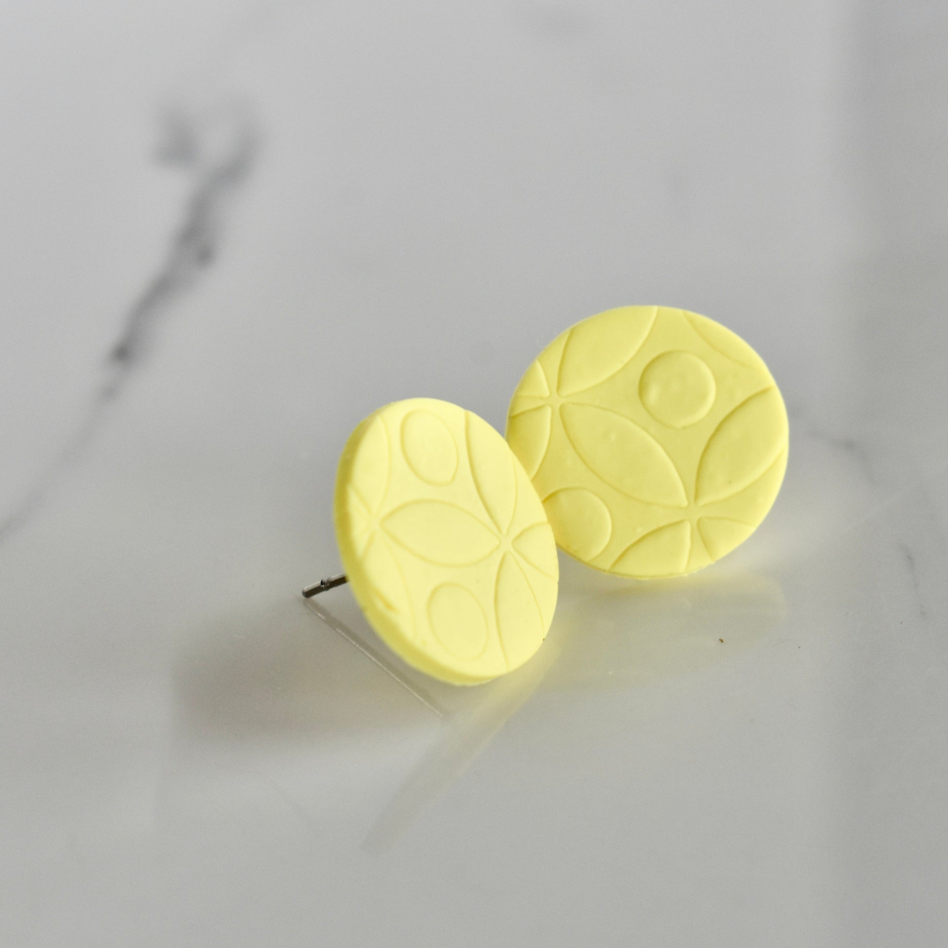 Handmade, light weight and comfortable to wear all day long clay studs earrings. Available in silver or gold. All our earring hooks are made with a high quality stainless steel and they are hypo allergenic.  They will not tarnish or irritate your sensitive skin.