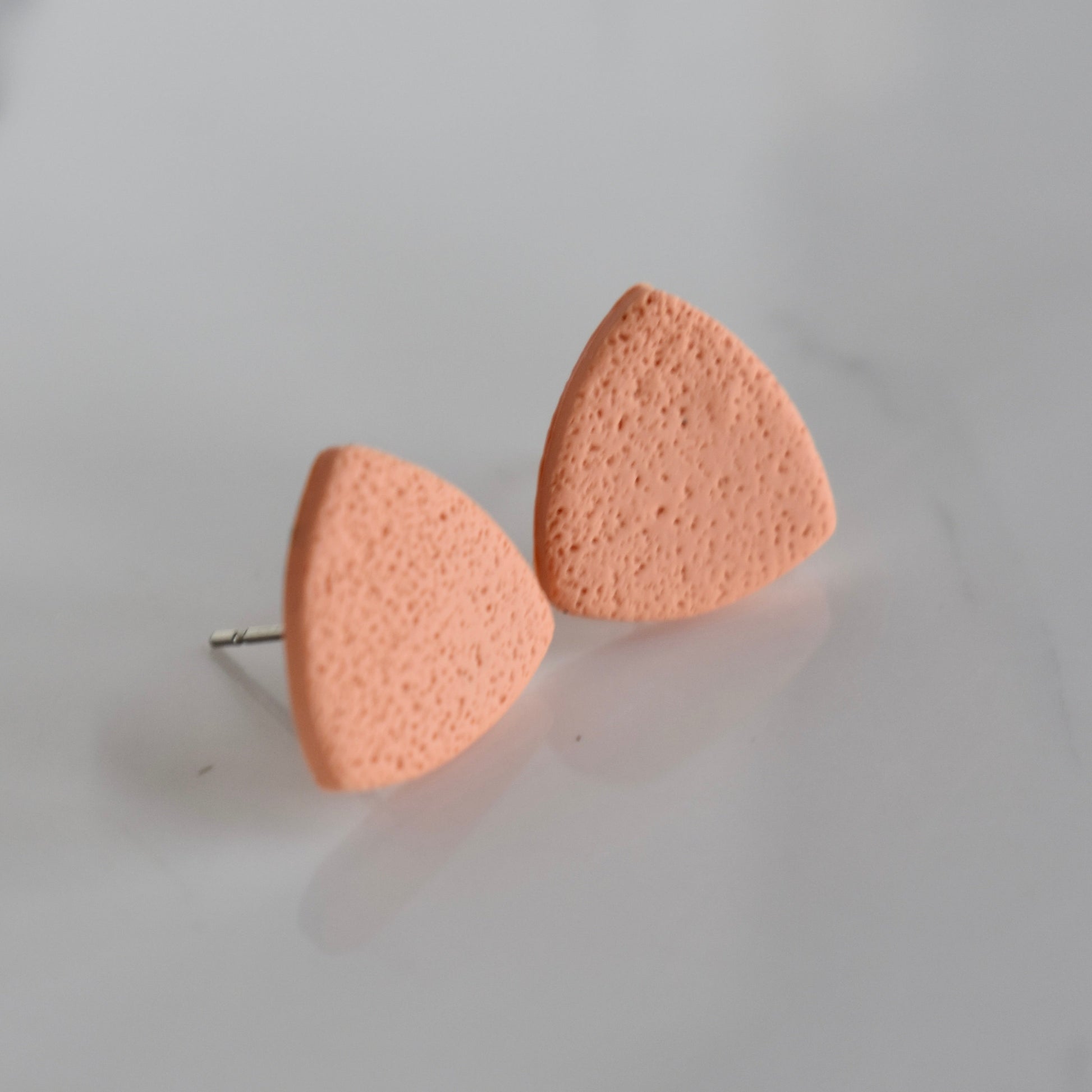 Handmade, light weight and comfortable to wear all day long clay studs earrings. Available in silver or gold. All our earring hooks are made with a high quality stainless steel and they are hypo allergenic.  They will not tarnish or irritate your sensitive skin.