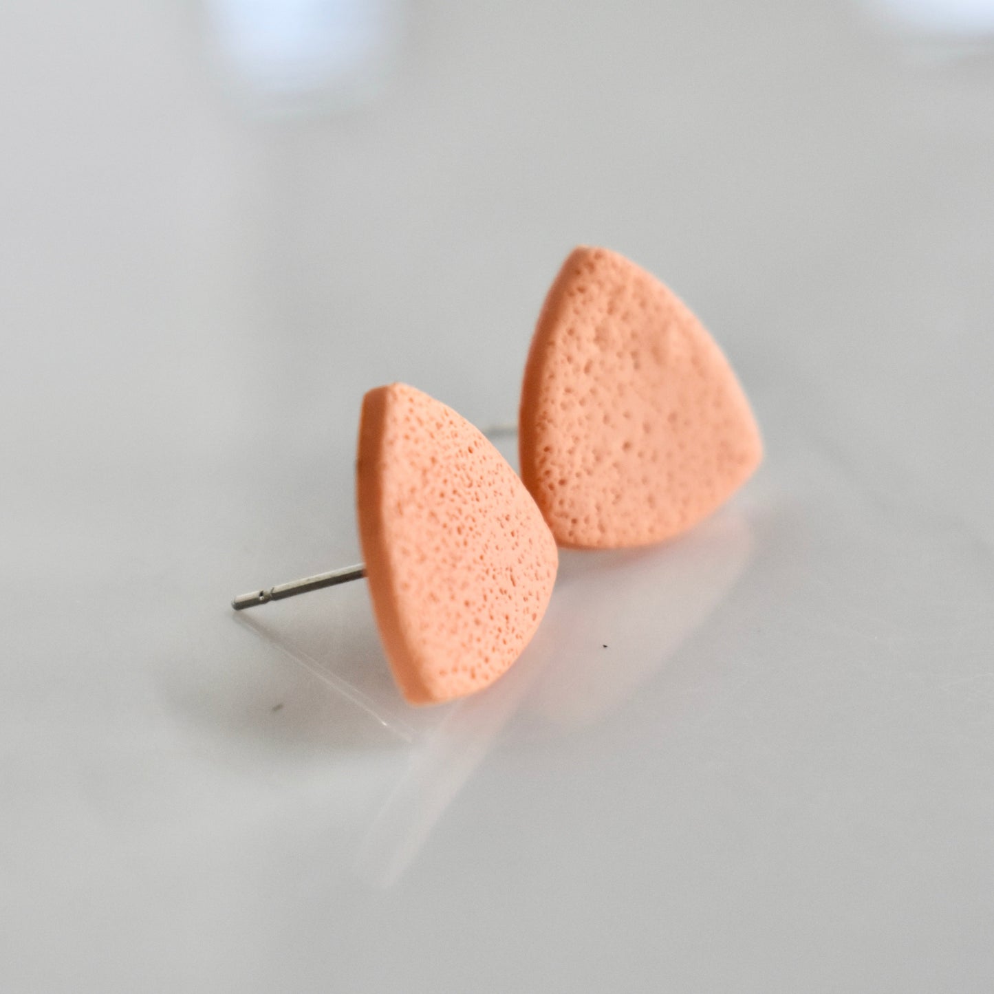 Handmade, light weight and comfortable to wear all day long clay studs earrings. Available in silver or gold. All our earring hooks are made with a high quality stainless steel and they are hypo allergenic.  They will not tarnish or irritate your sensitive skin.