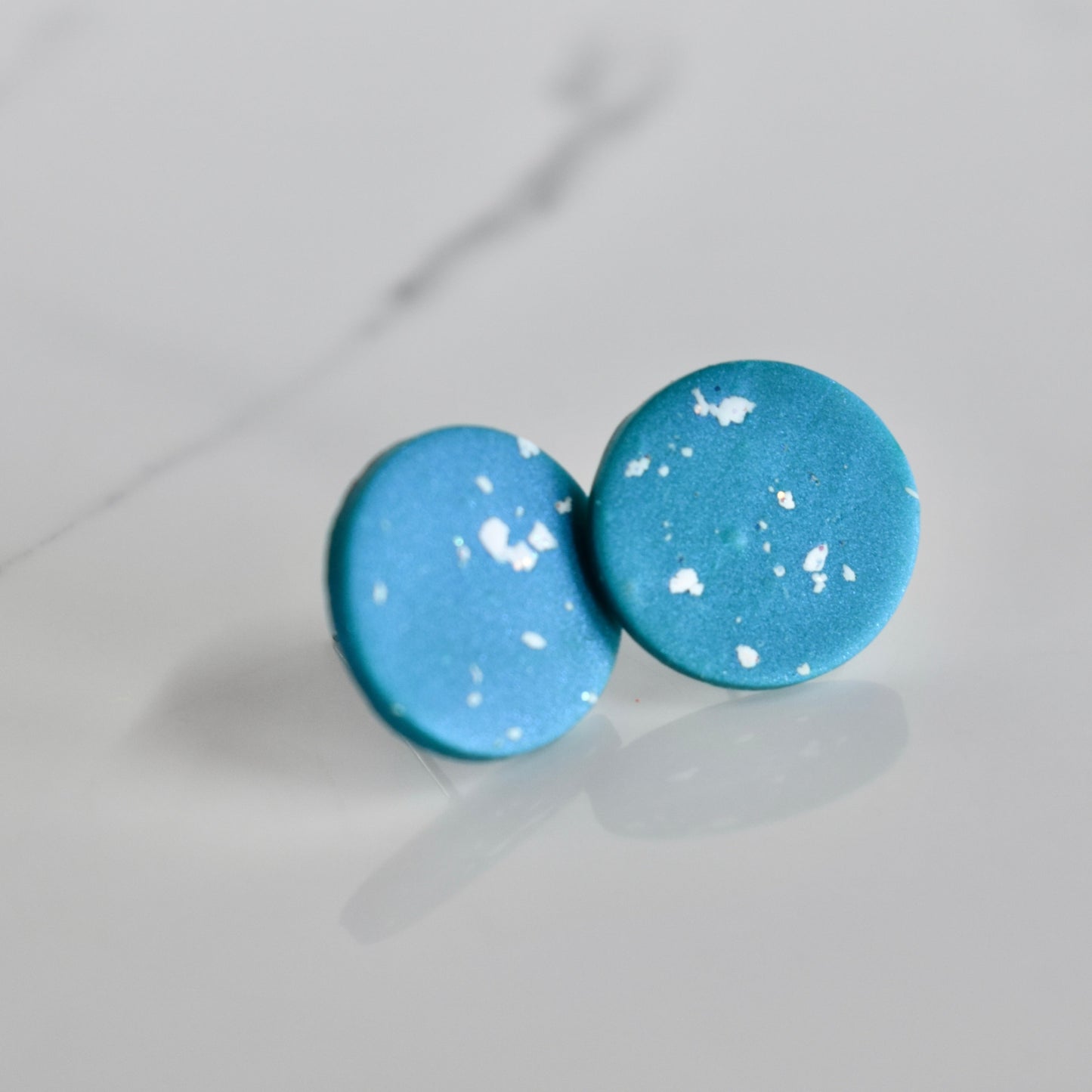 Handmade, light weight and comfortable to wear all day long clay studs earrings. Available in silver or gold. All our earring hooks are made with a high quality stainless steel and they are hypo allergenic.  They will not tarnish or irritate your sensitive skin.