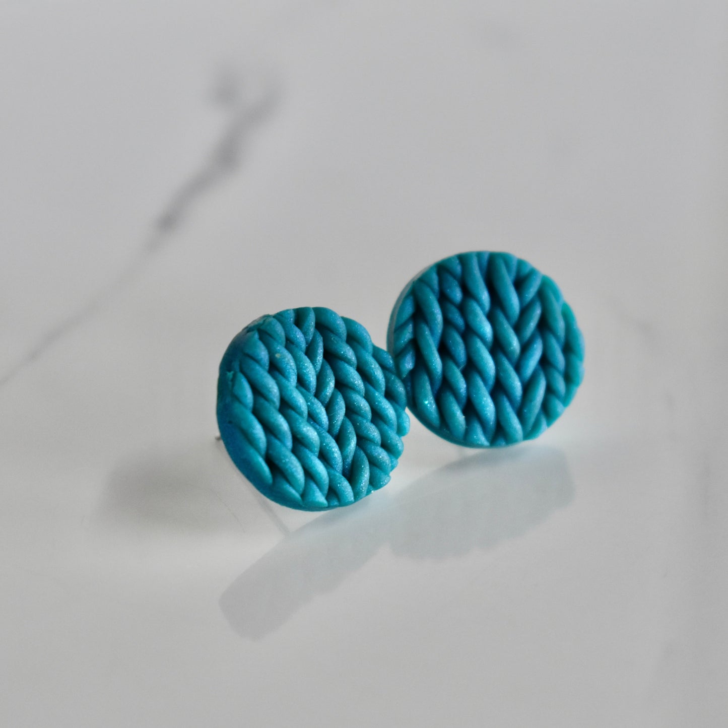 Handmade, light weight and comfortable to wear all day long clay studs earrings. Available in silver or gold. All our earring hooks are made with a high quality stainless steel and they are hypo allergenic.  They will not tarnish or irritate your sensitive skin.