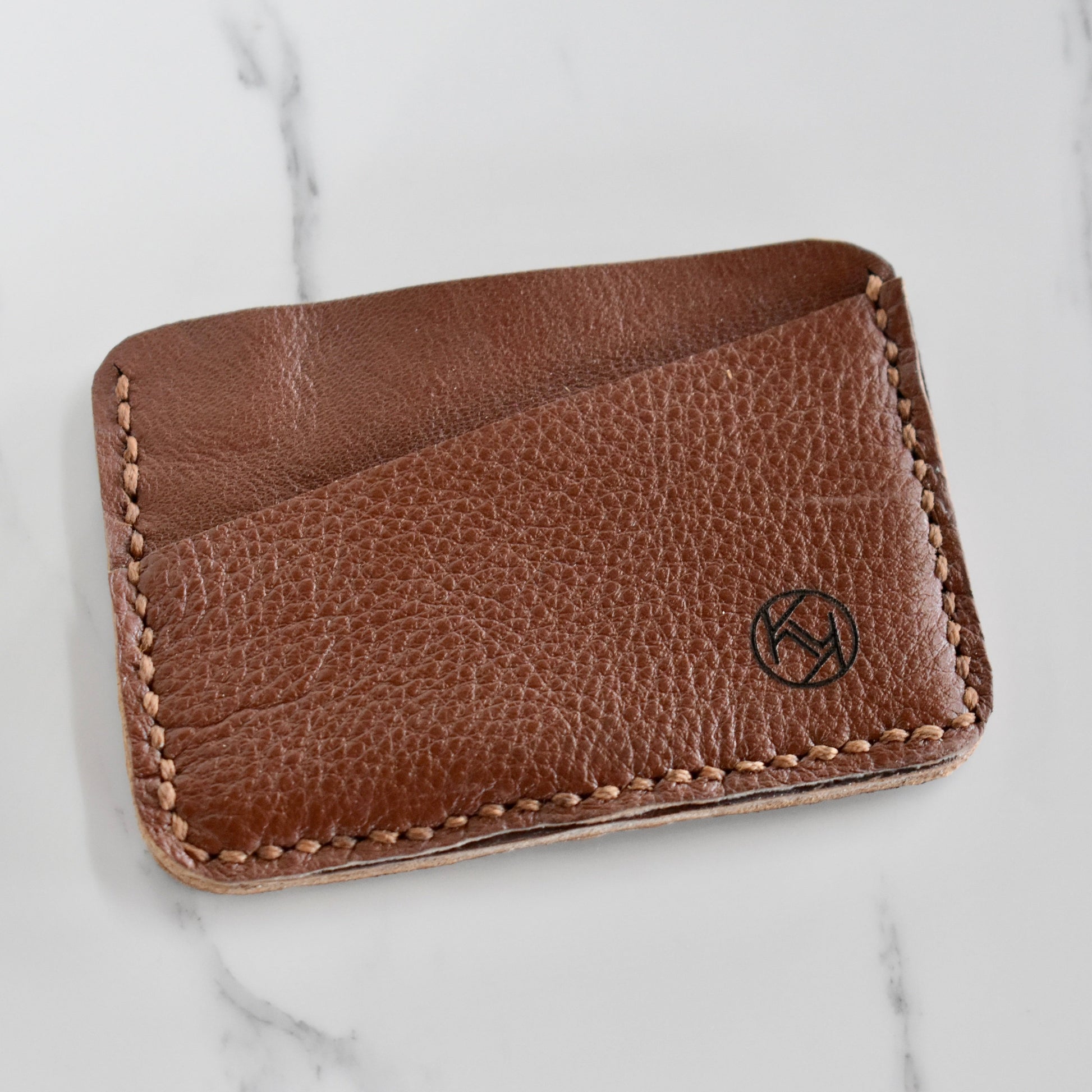 Beautifully hand made genuine leather card holder. Perfect gift idea for a man or women - it can store up to 6 cards.