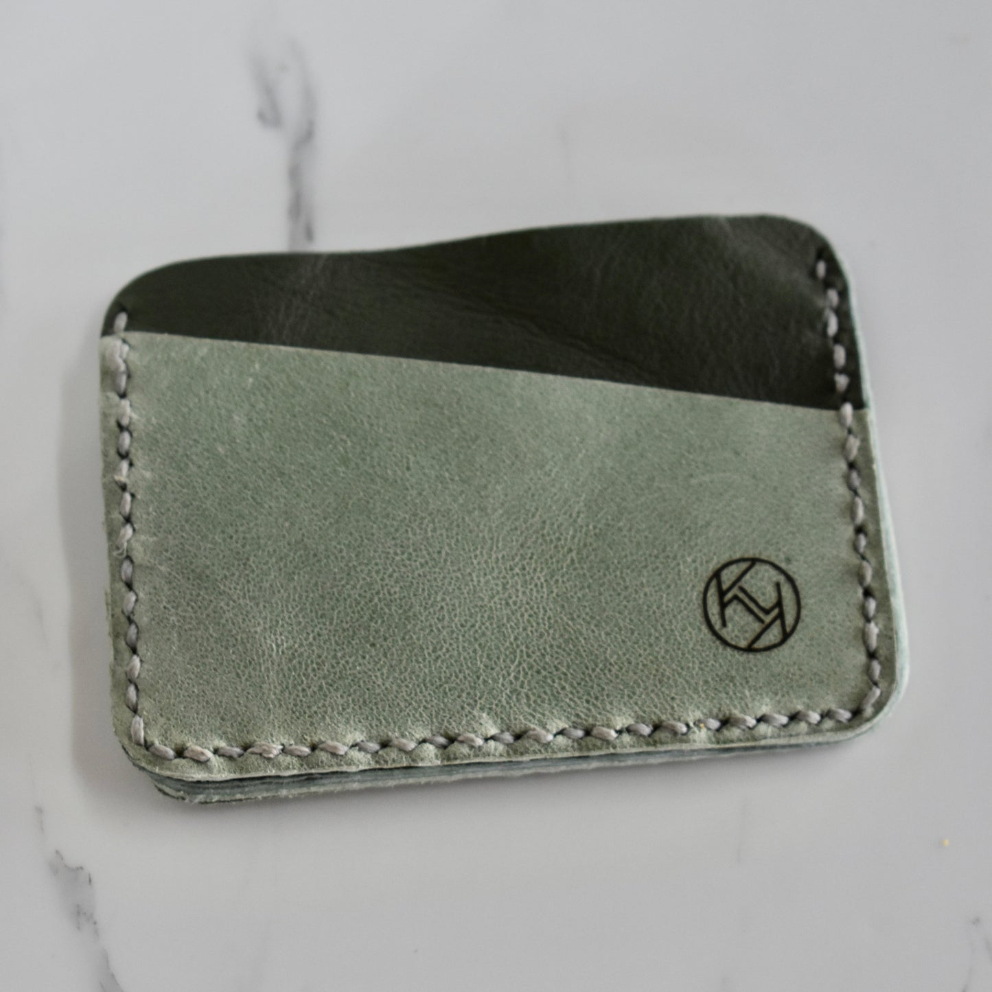 Beautifully hand made genuine leather card holder. Perfect gift idea for a man or women - it can store up to 6 cards.