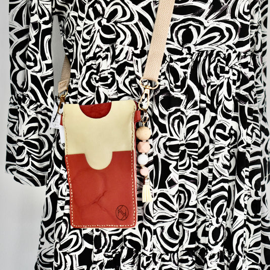 Beautifully handmade and hand stitched leather cellphone sling. Perfect for everyday use. It has a slot for cards and cash. Turn your sling towards your body for extra safety. This also makes an amazing gift and addition to a bridesmaids gift box. YOUR NEW BEST FRIEND - keep your belongings HANDS ON! 