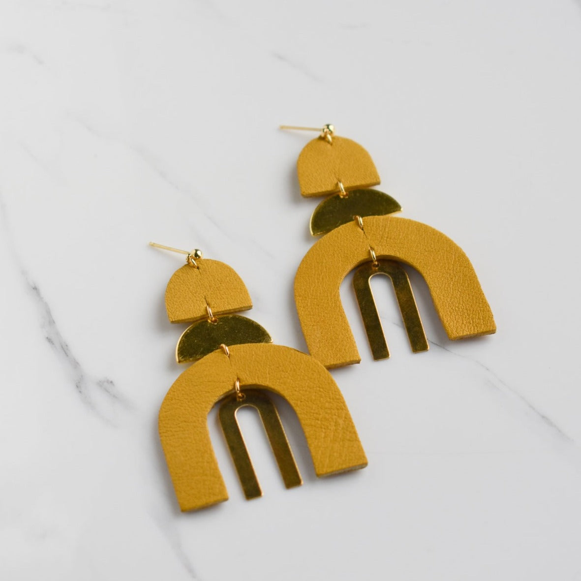 Handmade, light weight and comfortable to wear all day long leather earrings. All our earring hooks are made with a high quality stainless steel and they are hypo allergenic.  They will not tarnish or irritate your sensitive skin.