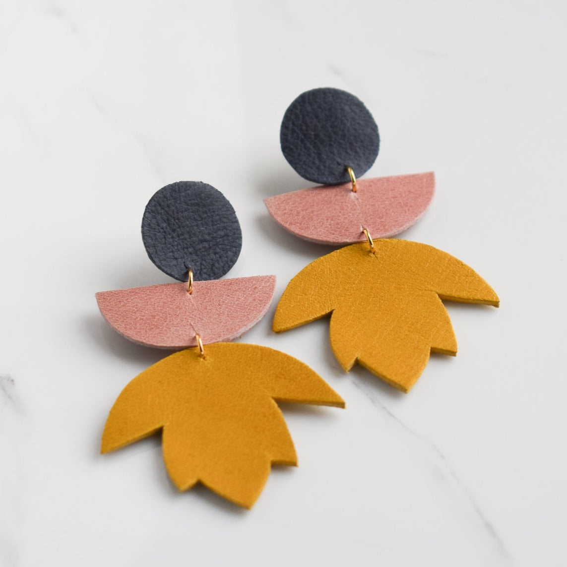 Handmade, light weight and comfortable to wear all day long leather earrings. All our earring hooks are made with a high quality stainless steel and they are hypo allergenic.  They will not tarnish or irritate your sensitive skin.