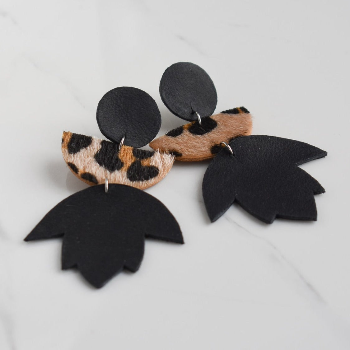 Handmade, light weight and comfortable to wear all day long leather earrings. All our earring hooks are made with a high quality stainless steel and they are hypo allergenic.  They will not tarnish or irritate your sensitive skin.