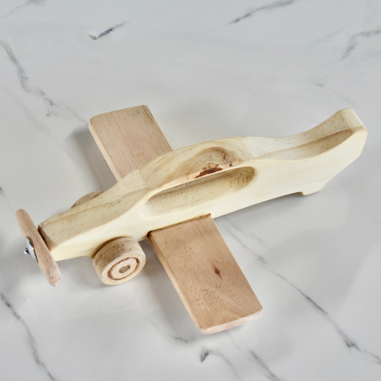 This hand held handmade wooden plane is the perfect present for any kid (or kid at heart)! It can be left as is or painted for an extra touch of fun. Makes for an amazing baby shower gift.