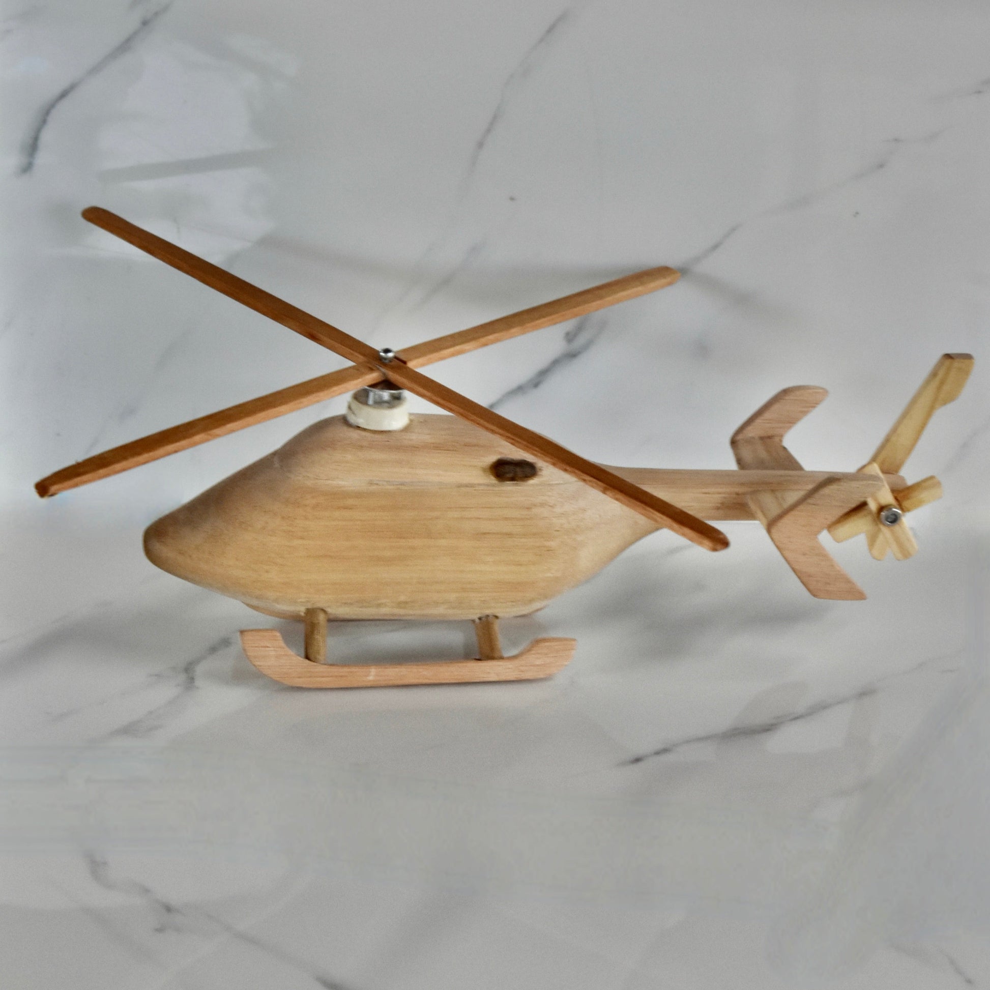 This small handmade wooden helicopter is the perfect present for any kid (or kid at heart)! It can be left as is or painted for an extra touch of fun. Makes for an amazing baby shower gift. 