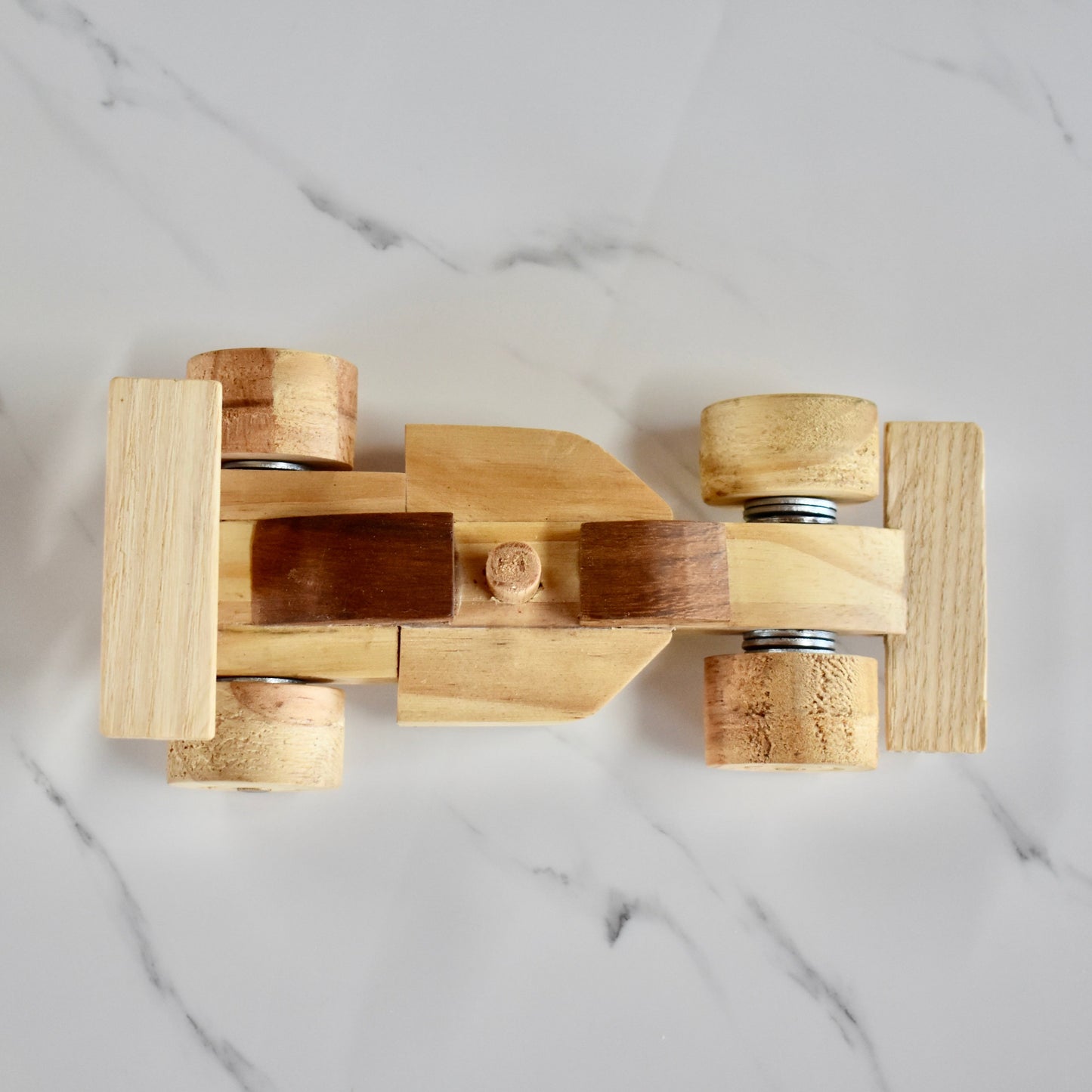 This small handmade wooden F1 racing car is the perfect present for any kid (or kid at heart)! It can be left as is or painted for an extra touch of fun. Makes for an amazing baby shower gift. Made with Kiaat solid wood and pine. 