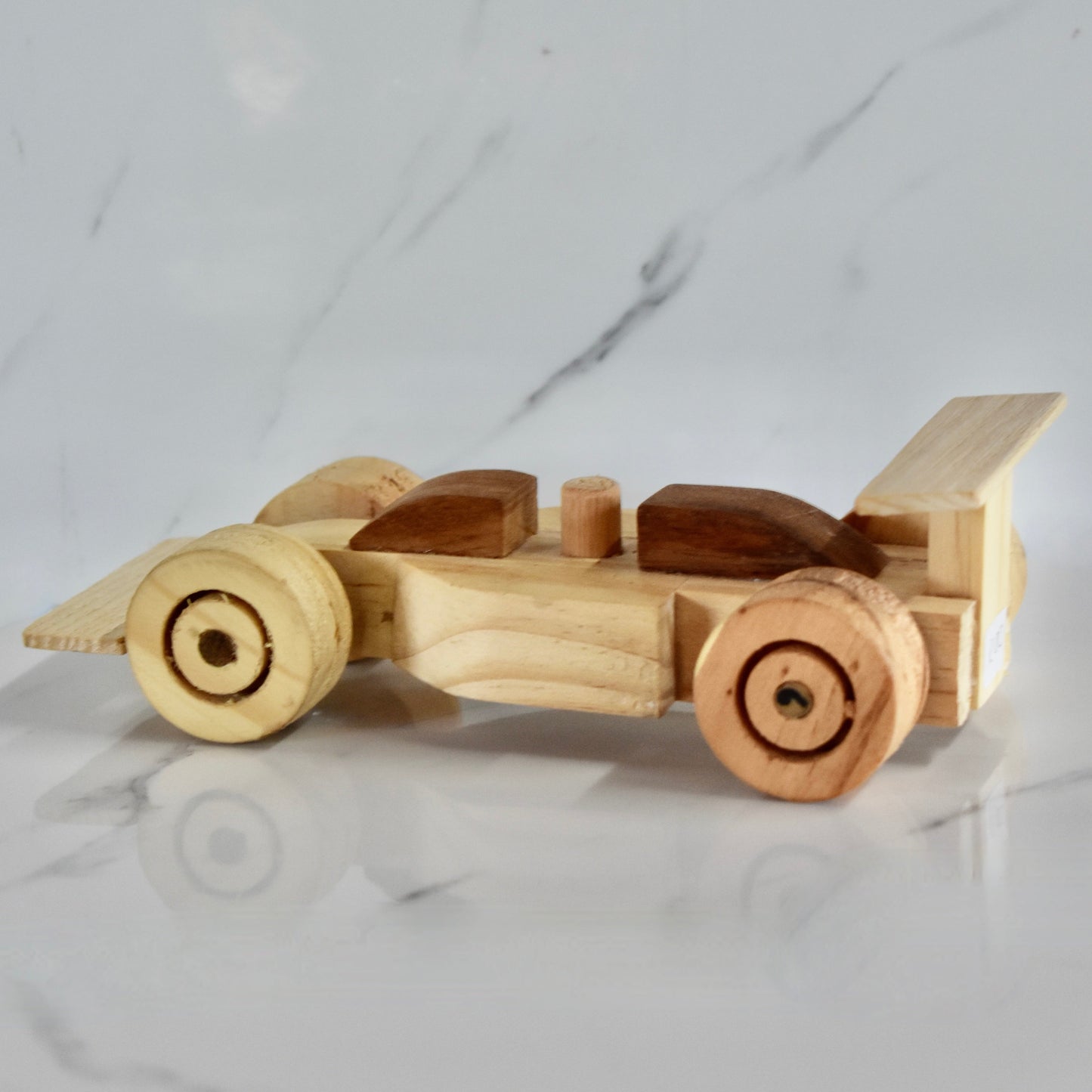 This small handmade wooden F1 racing car is the perfect present for any kid (or kid at heart)! It can be left as is or painted for an extra touch of fun. Makes for an amazing baby shower gift. Made with Kiaat solid wood and pine. 