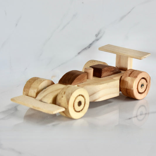 This small handmade wooden F1 racing car is the perfect present for any kid (or kid at heart)! It can be left as is or painted for an extra touch of fun. Makes for an amazing baby shower gift. Made with Kiaat solid wood and pine. 