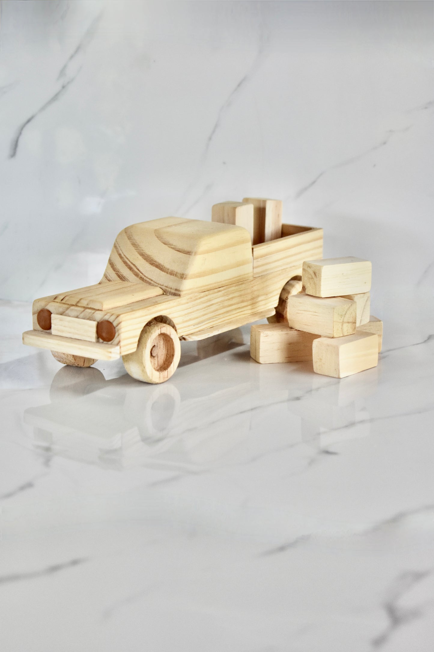 This small handmade wooden land cruiser is the perfect present for any kid (or kid at heart)! You also get some free lusern bales to unload and load on your cruiser. It can be left as is or painted for an extra touch of fun. Makes for an amazing baby shower gift. 