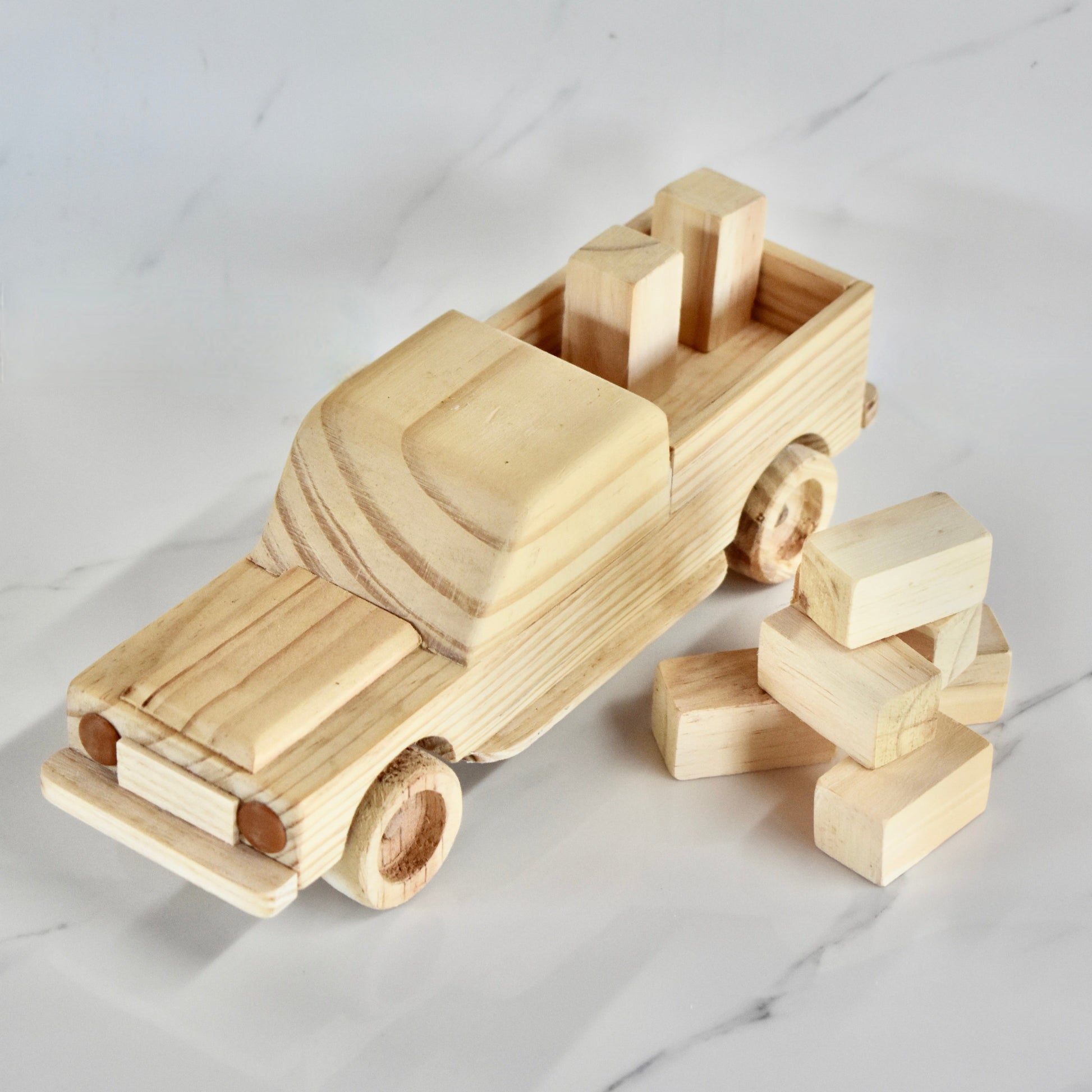 This small handmade wooden land cruiser is the perfect present for any kid (or kid at heart)! You also get some free lusern bales to unload and load on your cruiser. It can be left as is or painted for an extra touch of fun. Makes for an amazing baby shower gift. 