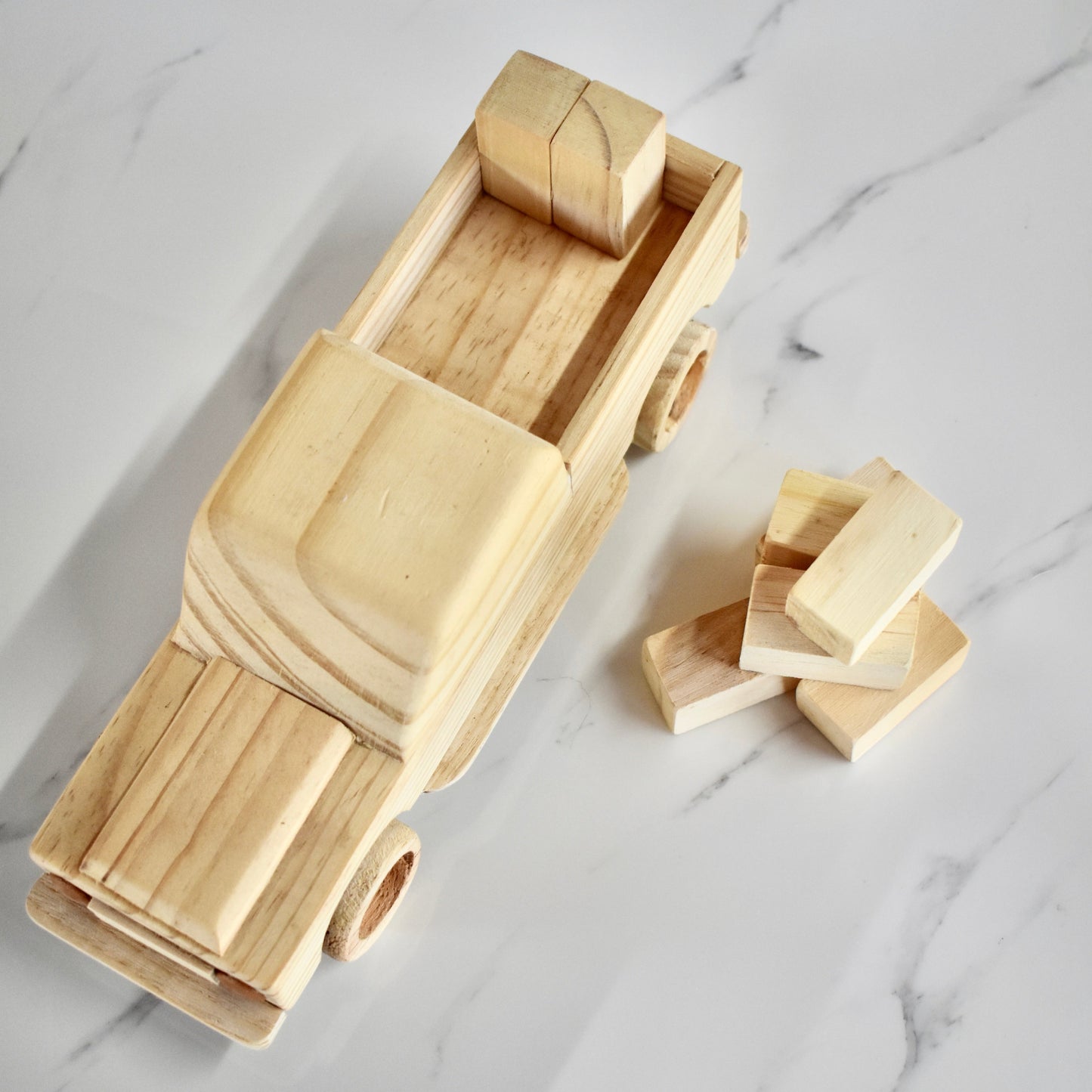 This small handmade wooden land cruiser is the perfect present for any kid (or kid at heart)! You also get some free lusern bales to unload and load on your cruiser. It can be left as is or painted for an extra touch of fun. Makes for an amazing baby shower gift. 