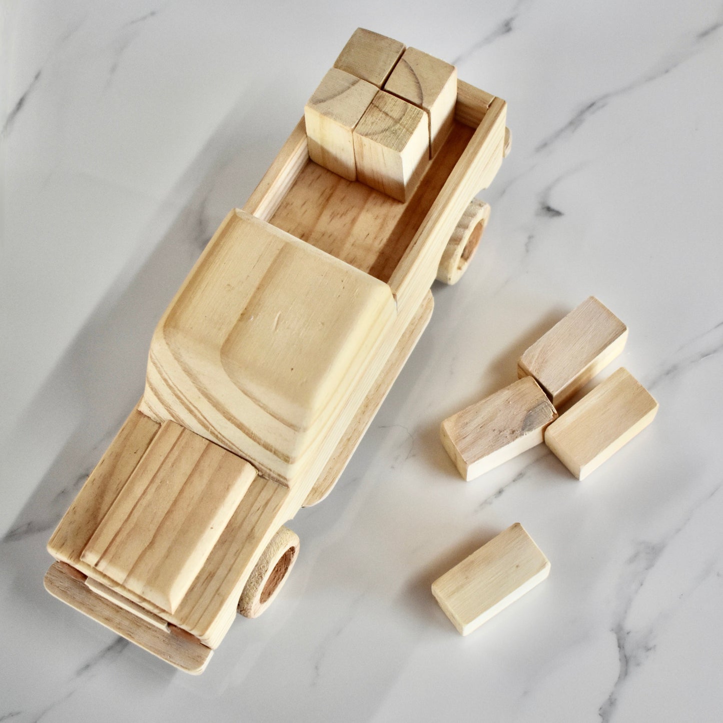 This small handmade wooden land cruiser is the perfect present for any kid (or kid at heart)! You also get some free lusern bales to unload and load on your cruiser. It can be left as is or painted for an extra touch of fun. Makes for an amazing baby shower gift. 