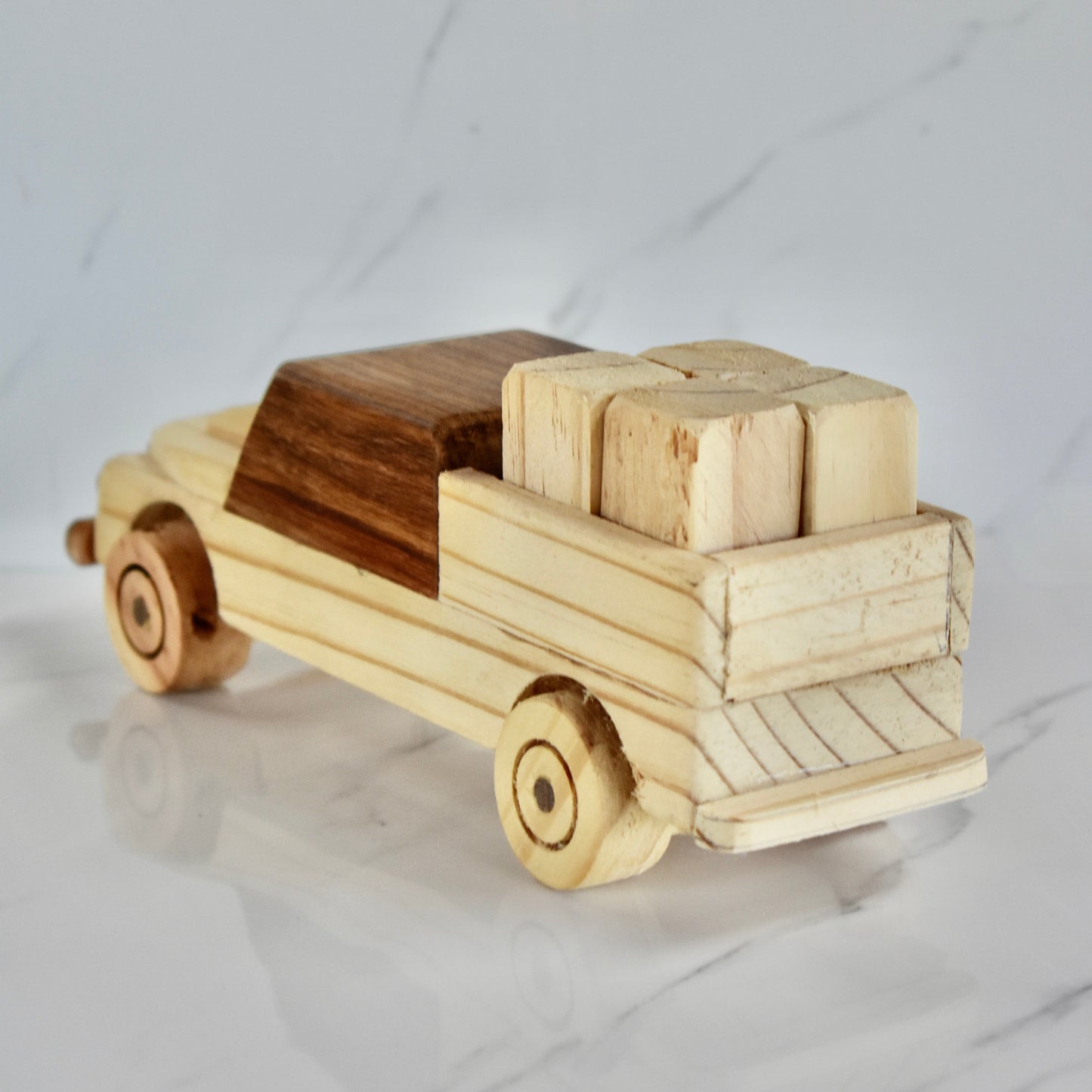 This small handmade wooden land cruiser is the perfect present for any kid (or kid at heart)! You also get some free lusern bales to unload and load on your cruiser. It can be left as is or painted for an extra touch of fun. Makes for an amazing baby shower gift. 