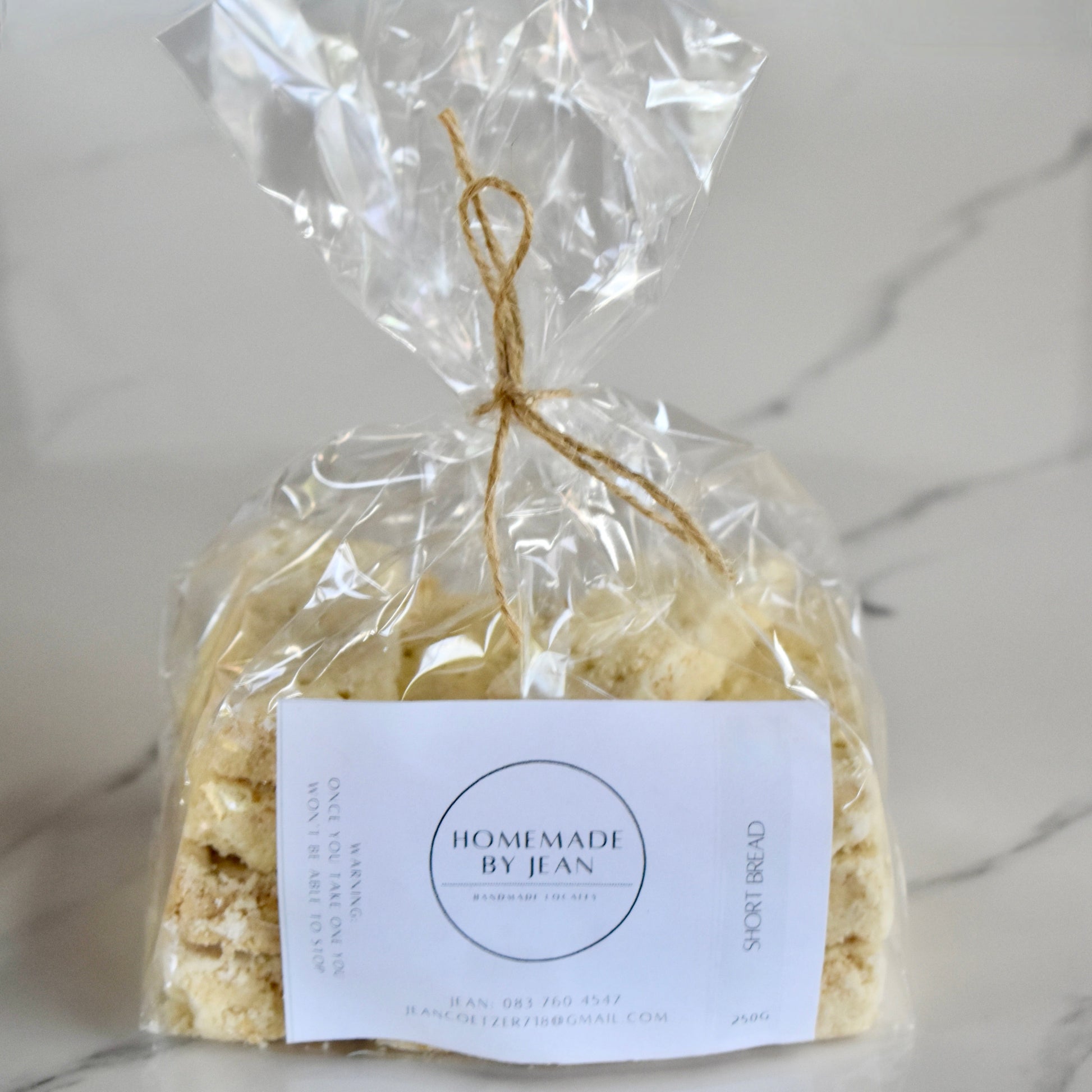 Indulge in decadent, just-out-of-the-oven homemade cookies. Delight in their melt-in-your-mouth texture and irresistible crispy goodness. Ideal for any occasion or as a luxurious gift. Personalised wedding favor choices are also on offer. For larger quantities, take advantage of our bulk discount and beautifully package them for your guests.