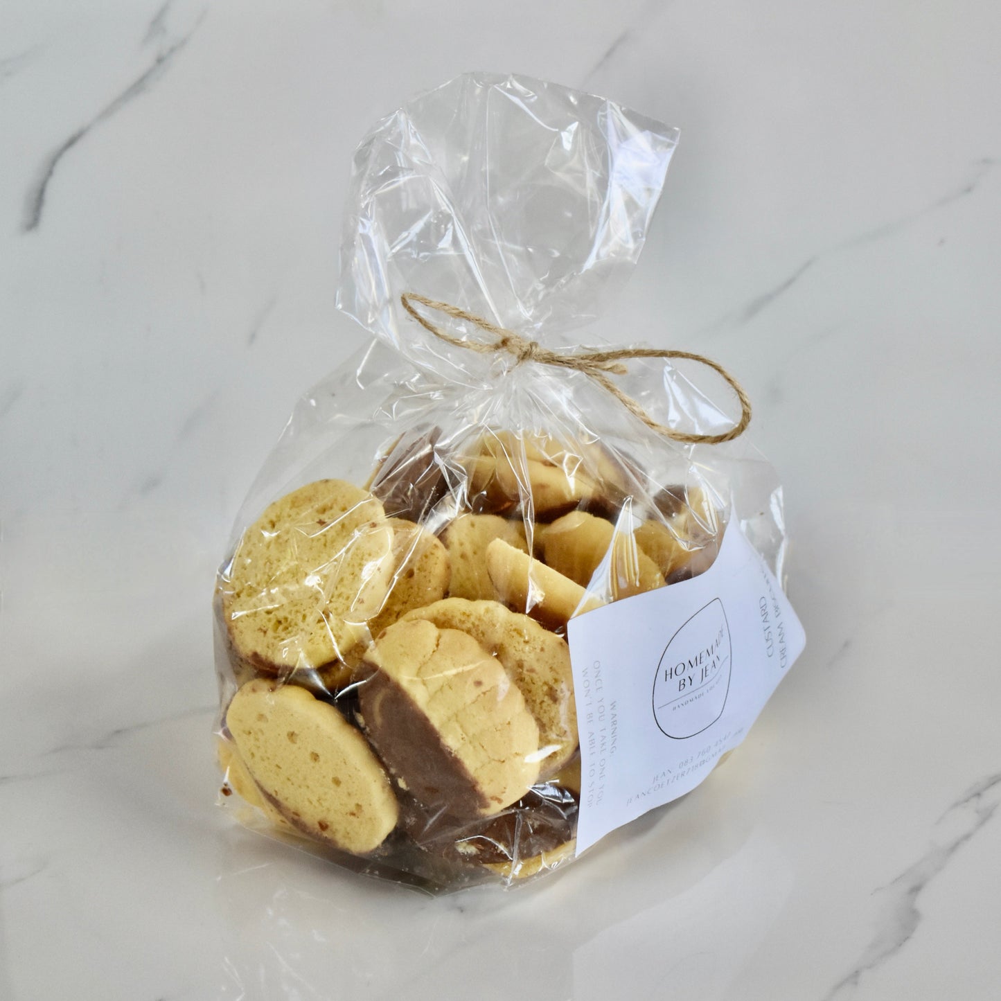 Indulge in decadent, just-out-of-the-oven homemade cookies. Delight in their melt-in-your-mouth texture and irresistible crispy goodness. Ideal for any occasion or as a luxurious gift. Personalised wedding favor choices are also on offer. For larger quantities, take advantage of our bulk discount and beautifully package them for your guests.