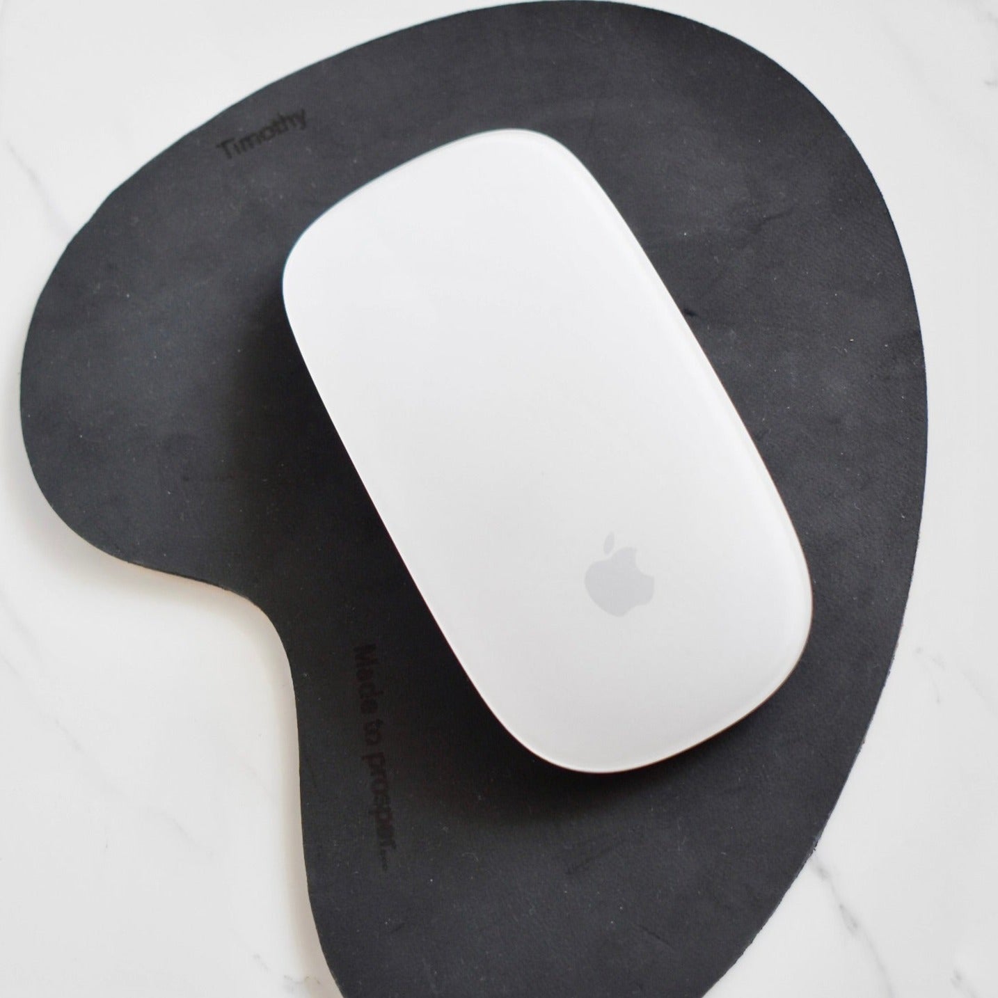 Handmade, organic shaped, genuine leather mouse pad. 