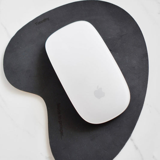 Handmade, organic shaped, genuine leather mouse pad. 