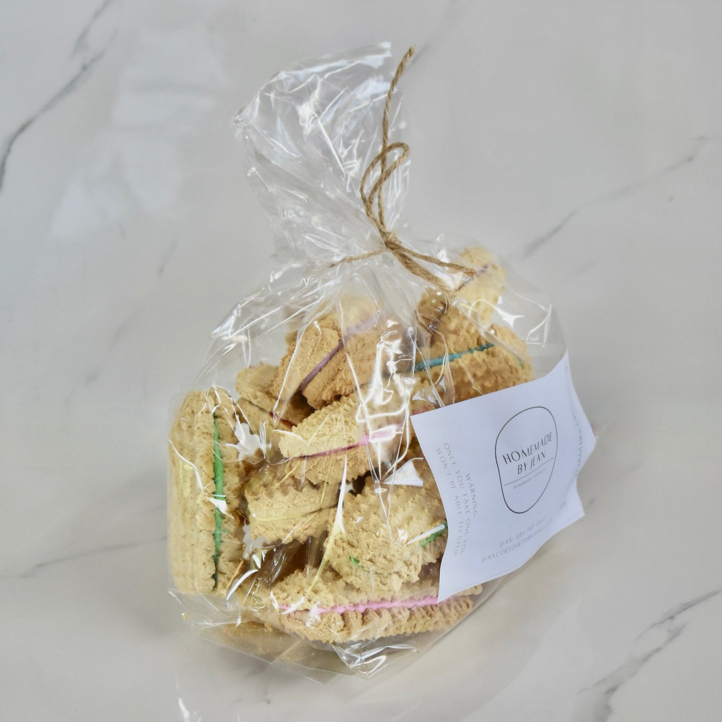 Indulge in decadent, just-out-of-the-oven homemade cookies. Delight in their melt-in-your-mouth texture and irresistible crispy goodness. Ideal for any occasion or as a luxurious gift. Personalised wedding favor choices are also on offer. For larger quantities, take advantage of our bulk discount and beautifully package them for your guests.