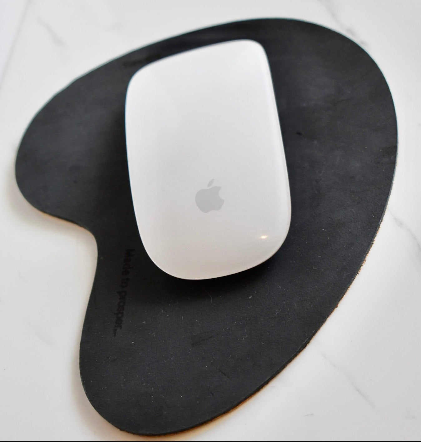 Handmade, organic shaped, genuine leather mouse pad. 