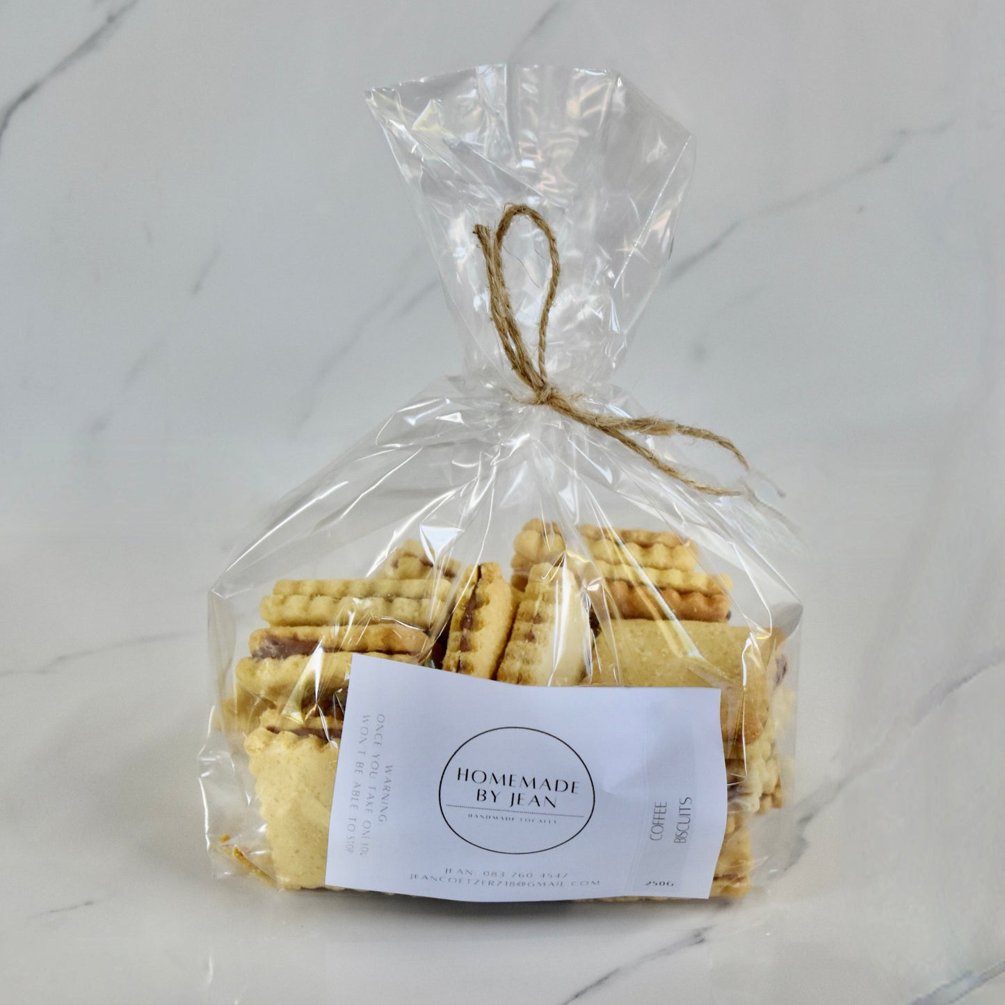 Indulge in decadent, just-out-of-the-oven homemade cookies. Delight in their melt-in-your-mouth texture and irresistible crispy goodness. Ideal for any occasion or as a luxurious gift. Personalised wedding favor choices are also on offer. For larger quantities, take advantage of our bulk discount and beautifully package them for your guests.