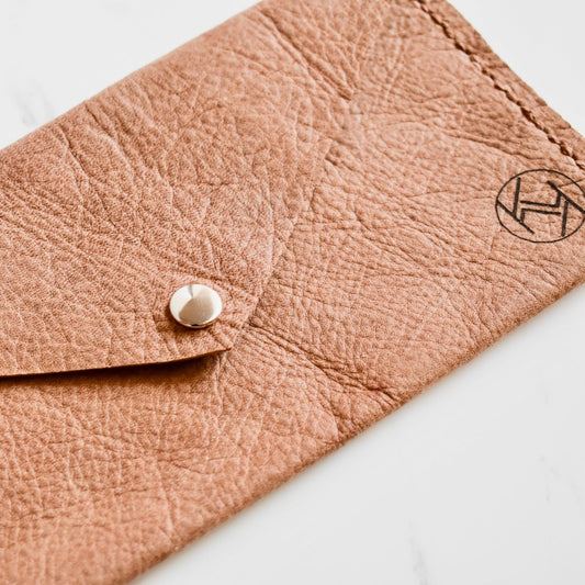 Beautifully handmade and hand stitched leather clutch. Perfect for a quick trip to the shop or even to keep your sunglasses save. Use it as a make up bag or pencil case. This also makes an amazing addition to a bridesmaids gift box. 