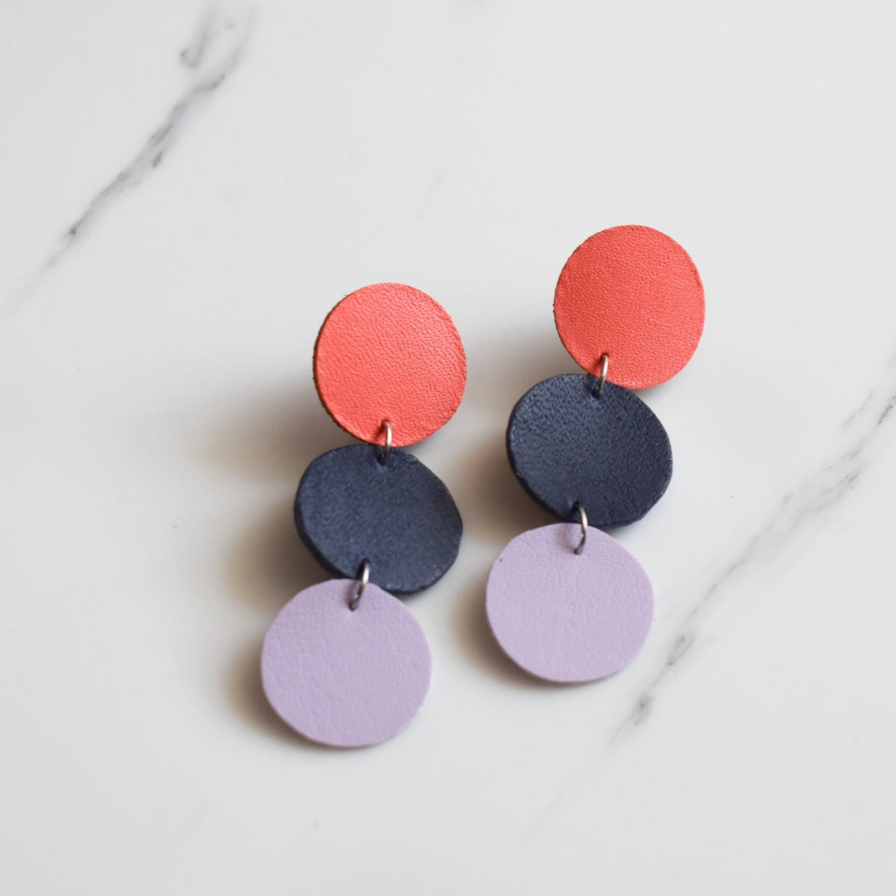 Handmade, light weight and comfortable to wear all day long leather earrings. All our earring hooks are made with a high quality stainless steel and they are hypo allergenic.  They will not tarnish or irritate your sensitive skin.